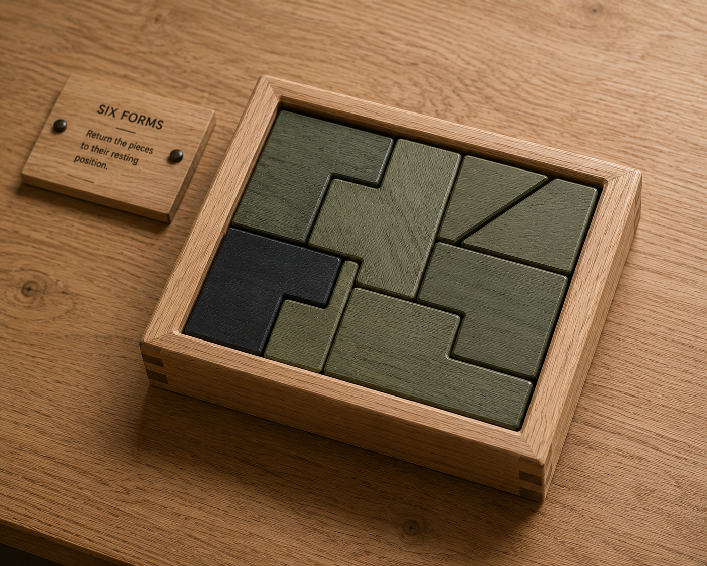 Wooden puzzle game with green and black pieces inside a wooden box on a wooden table, with a small wooden sign that reads "Six Forms" and instructs to return pieces to their resting position.