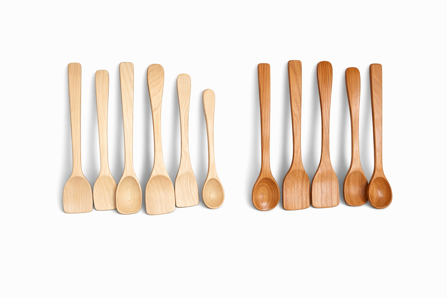 Two rows of wooden spoons, with the left row made of light-colored wood and the right row made of darker-colored wood, arranged against a white background.
