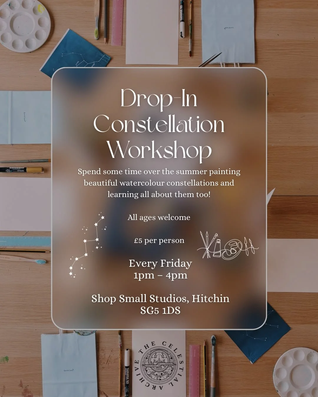 A flyer for a Drop-In Constellation Workshop over a wooden table with watercolor paints, brushes, notebooks, and pens.