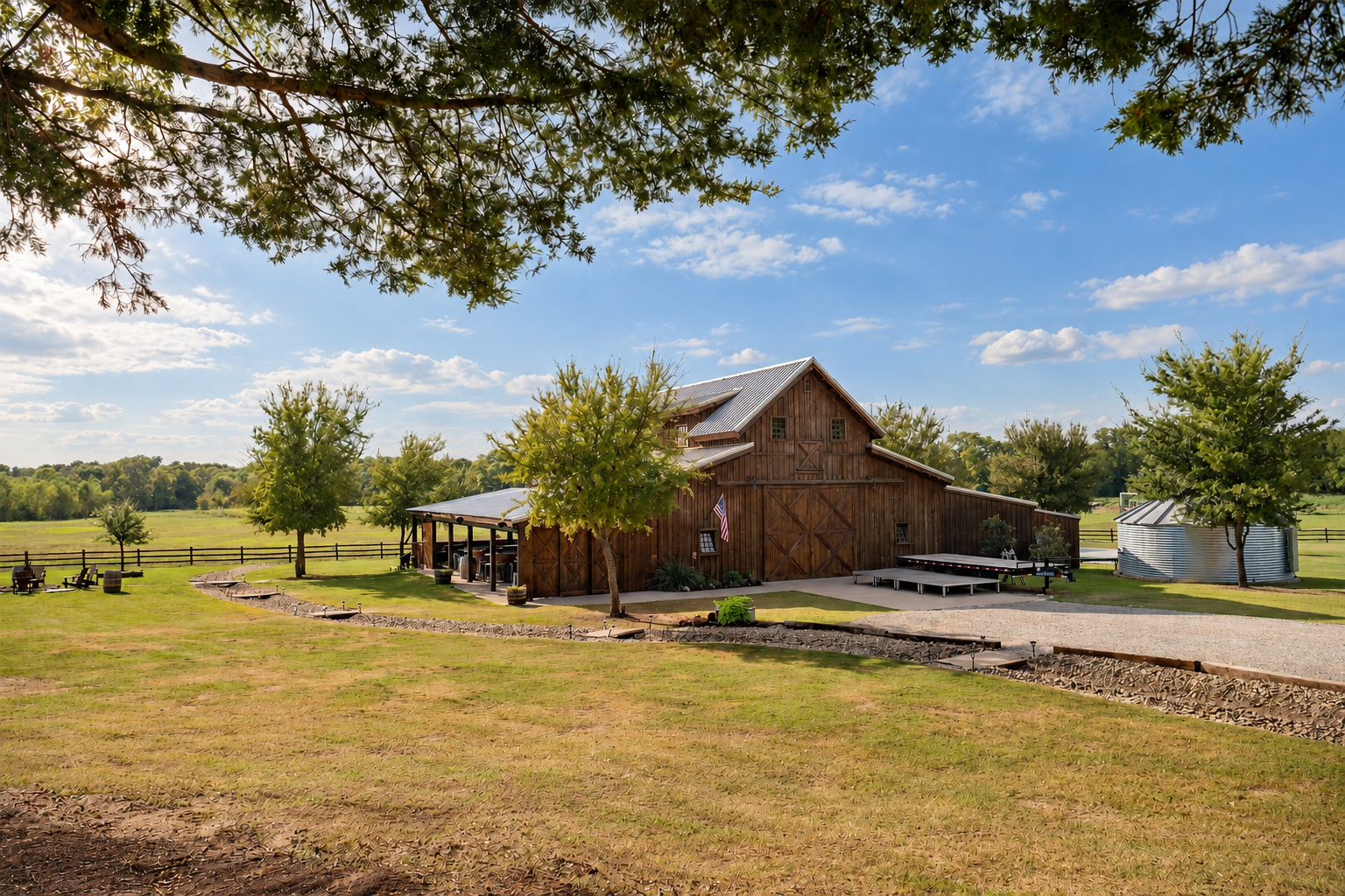 Rustic Barn Under Partly Cloudy Skies.png