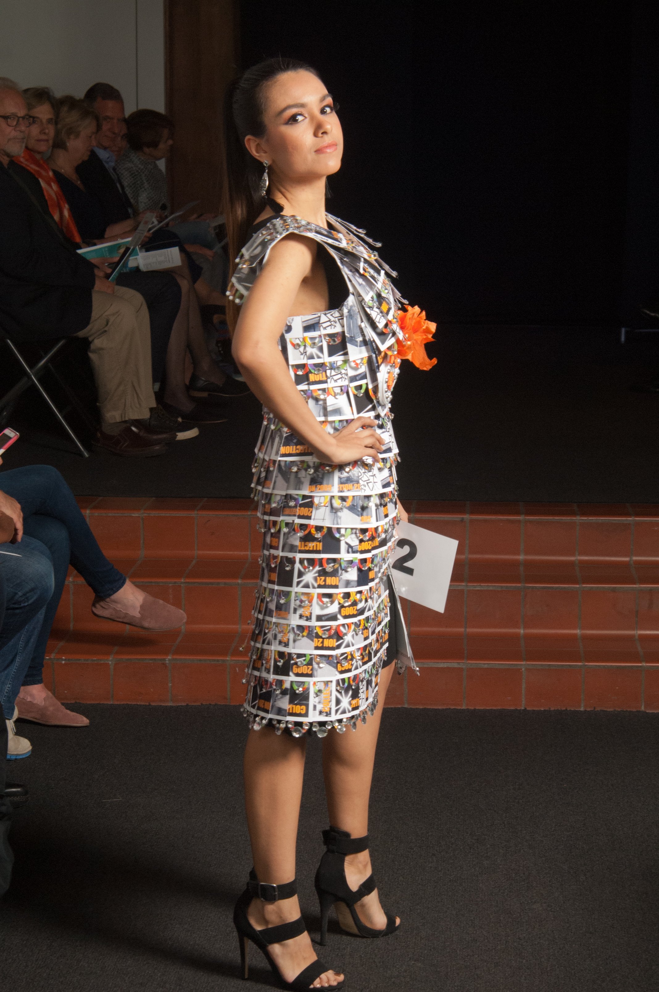 Model wearing garment made out of images.