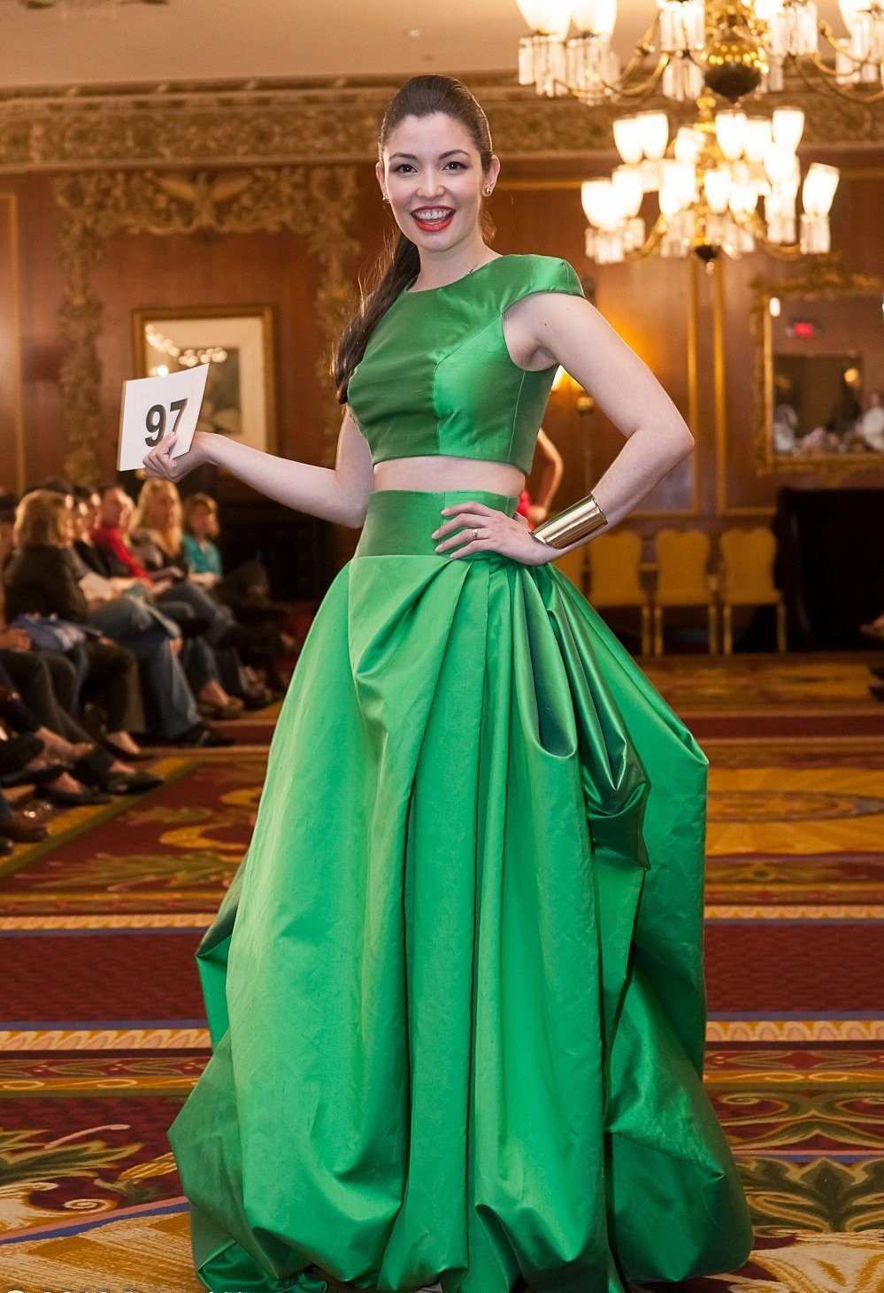 Model wearing kelly green 2-piece set.  The top is cropped, with a high waisted, floor length skirt.