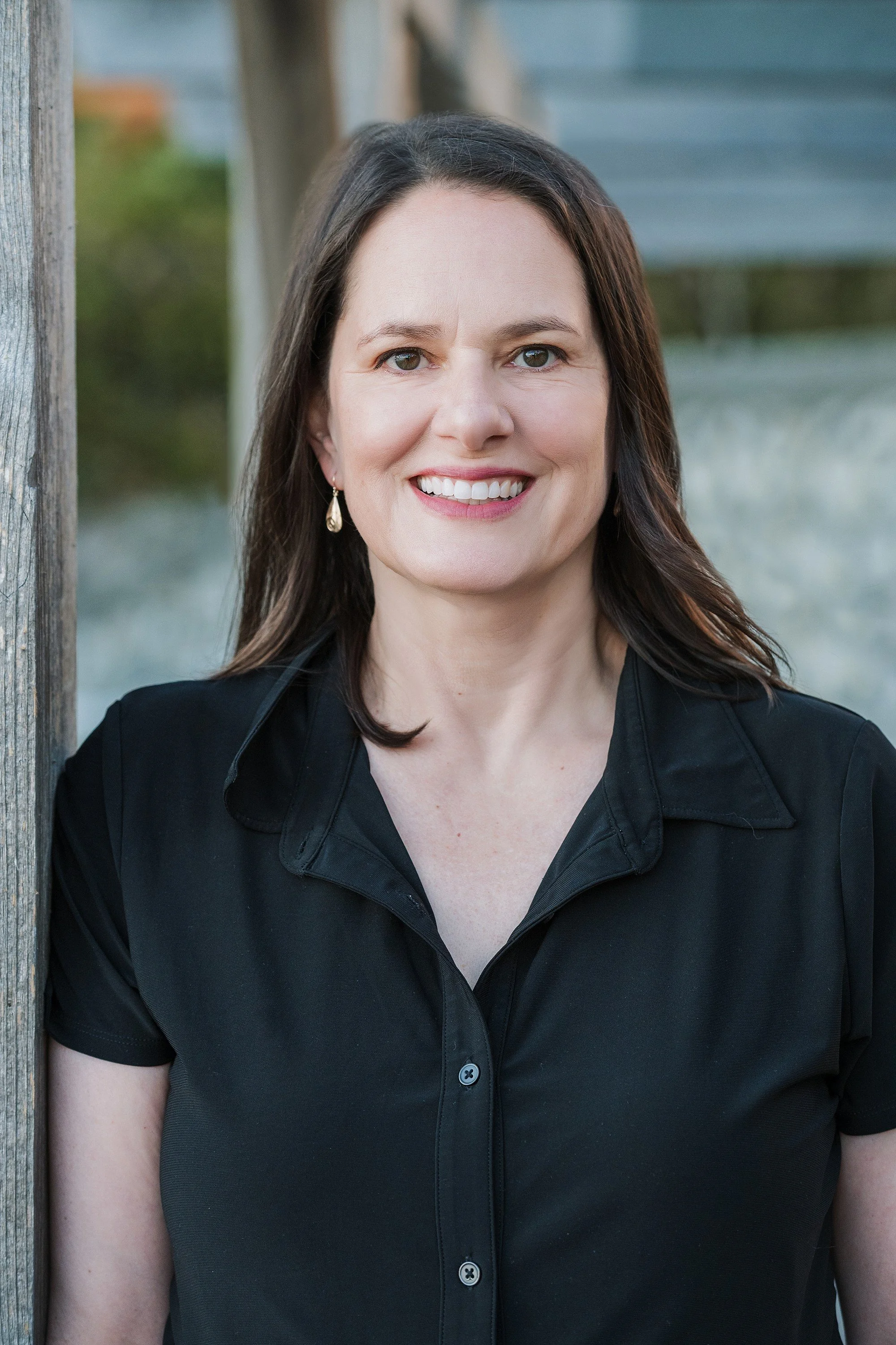 Professional female headshot in Victoria BC featuring an authentic, natural expression for a local business owner or senior consultant.