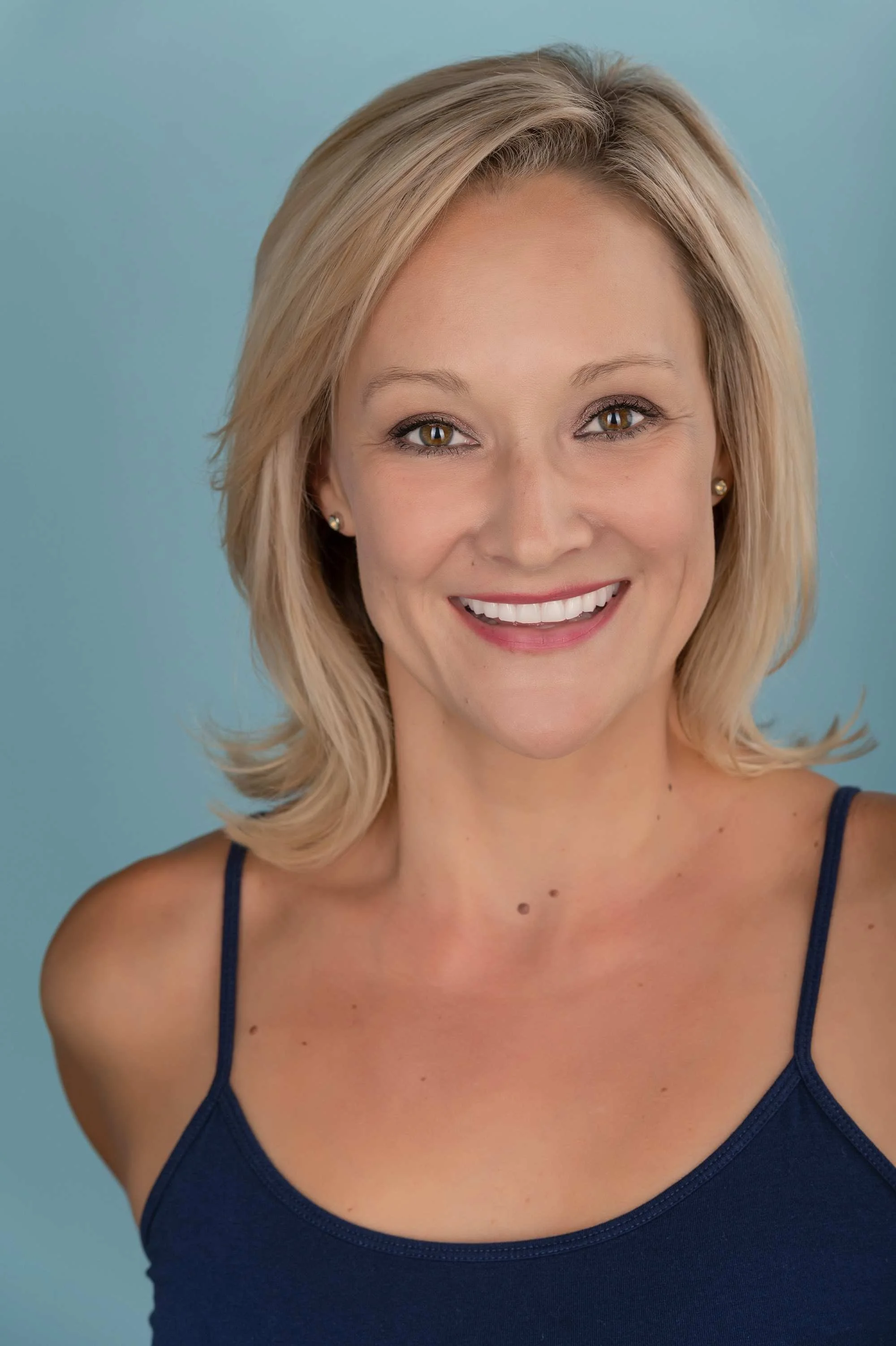 Professional actor headshot in a Victoria BC studio, showcasing a natural expression and clean lighting designed to meet the specific requirements of talent agencies and casting directors.