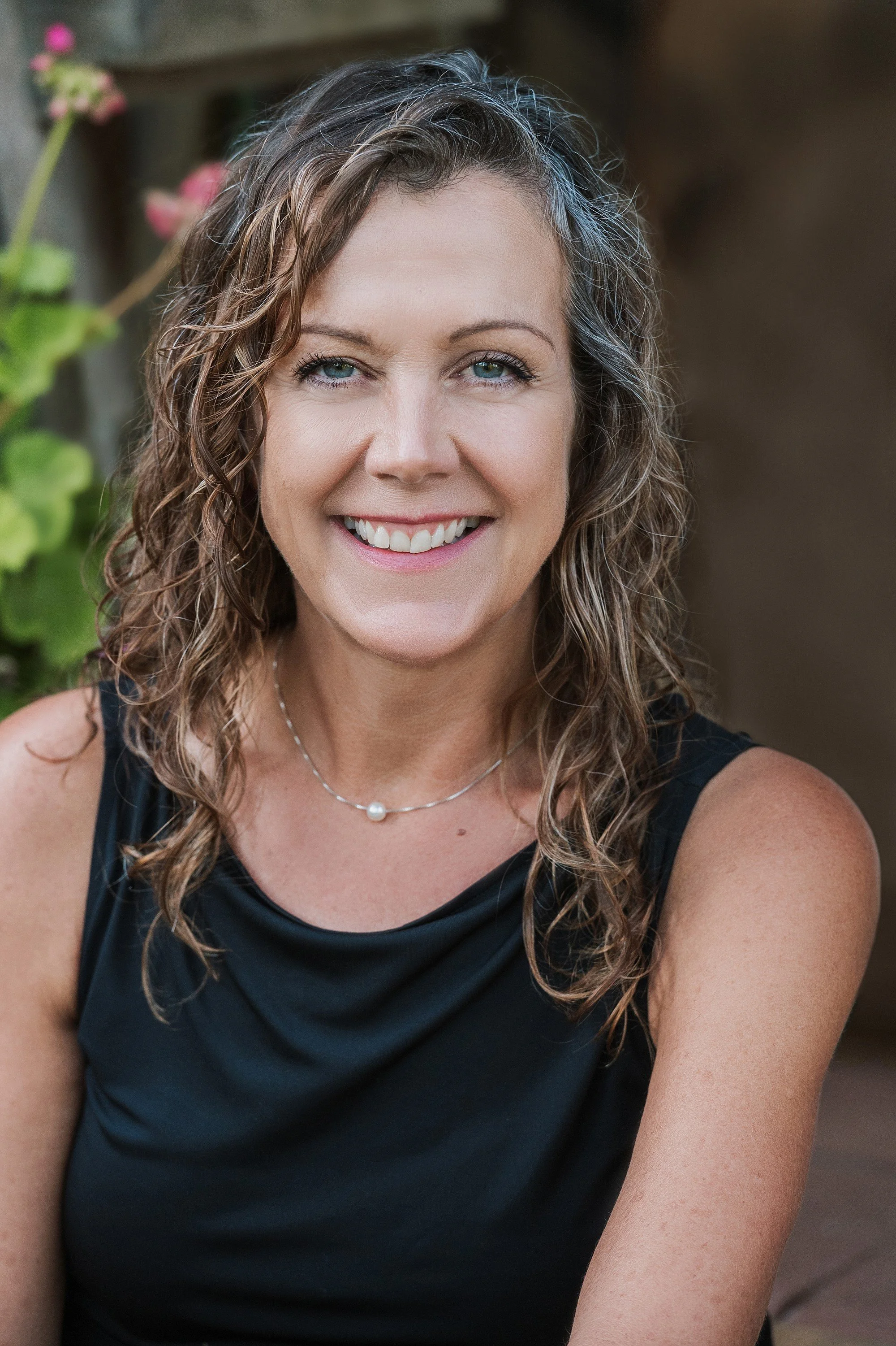 Outdoor professional headshot for a Victoria BC executive, captured in natural light by Erin Clayton Photography to create an approachable and confident look.