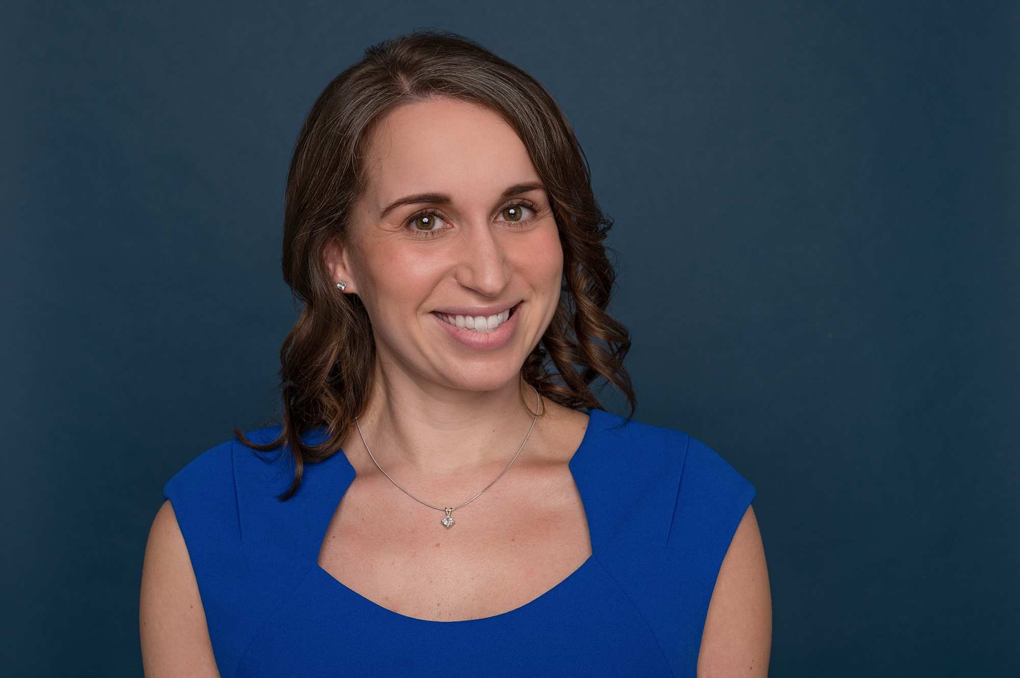 Studio professional headshot for a Victoria BC healthcare executive, captured using professional lighting by Erin Clayton Photography to create an approachable and confident look.