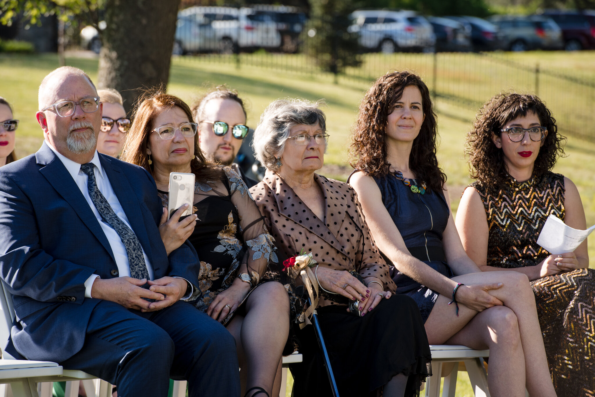 Wedding guests look on from seats during ceremony at Roger Williams Botanical Center Providence Rhode Island Michelle Schapiro New England Event Photographer