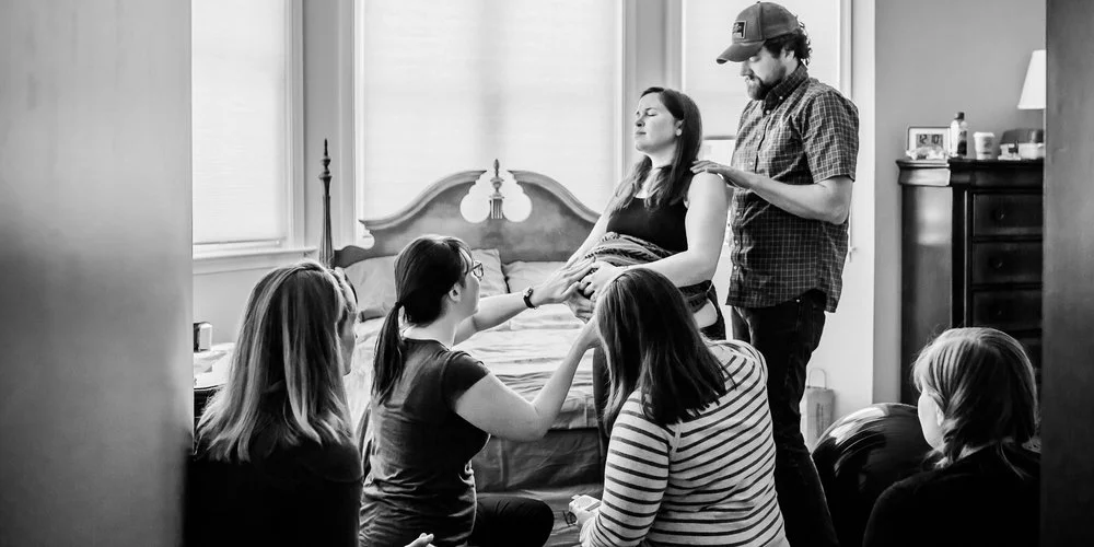 Doulas, Midwives, and Family during a home birth in Maryland