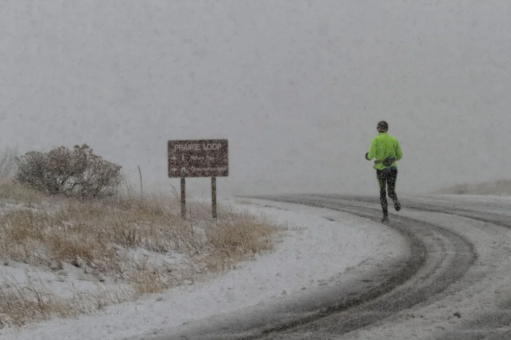 A Runner Braving a Snow Storm in Cherry Creek State Park