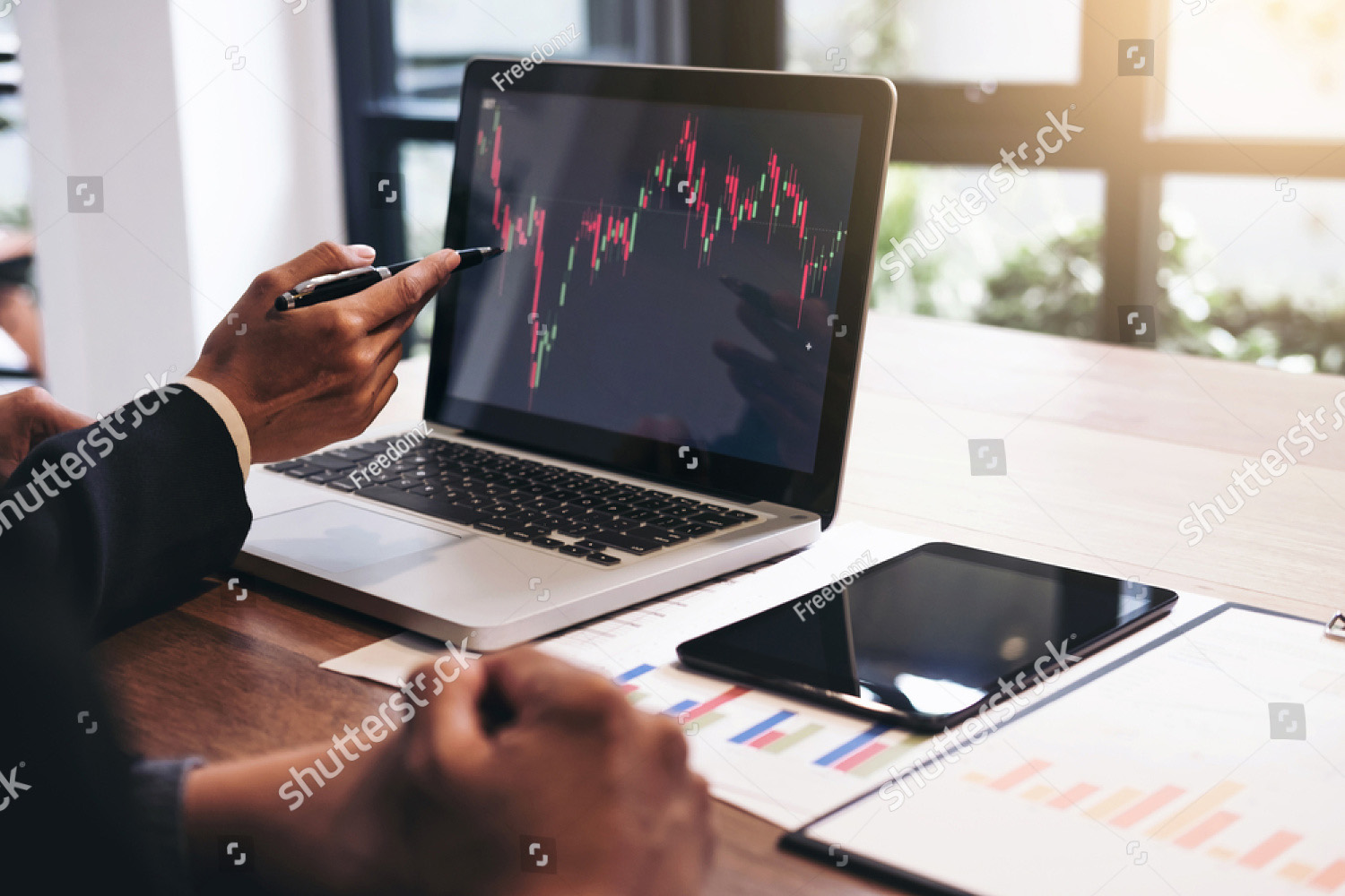 stock-photo-business-team-two-colleagues-working-with-computer-digital-tablet-discussing-and-analysis-graph-706247503.jpg