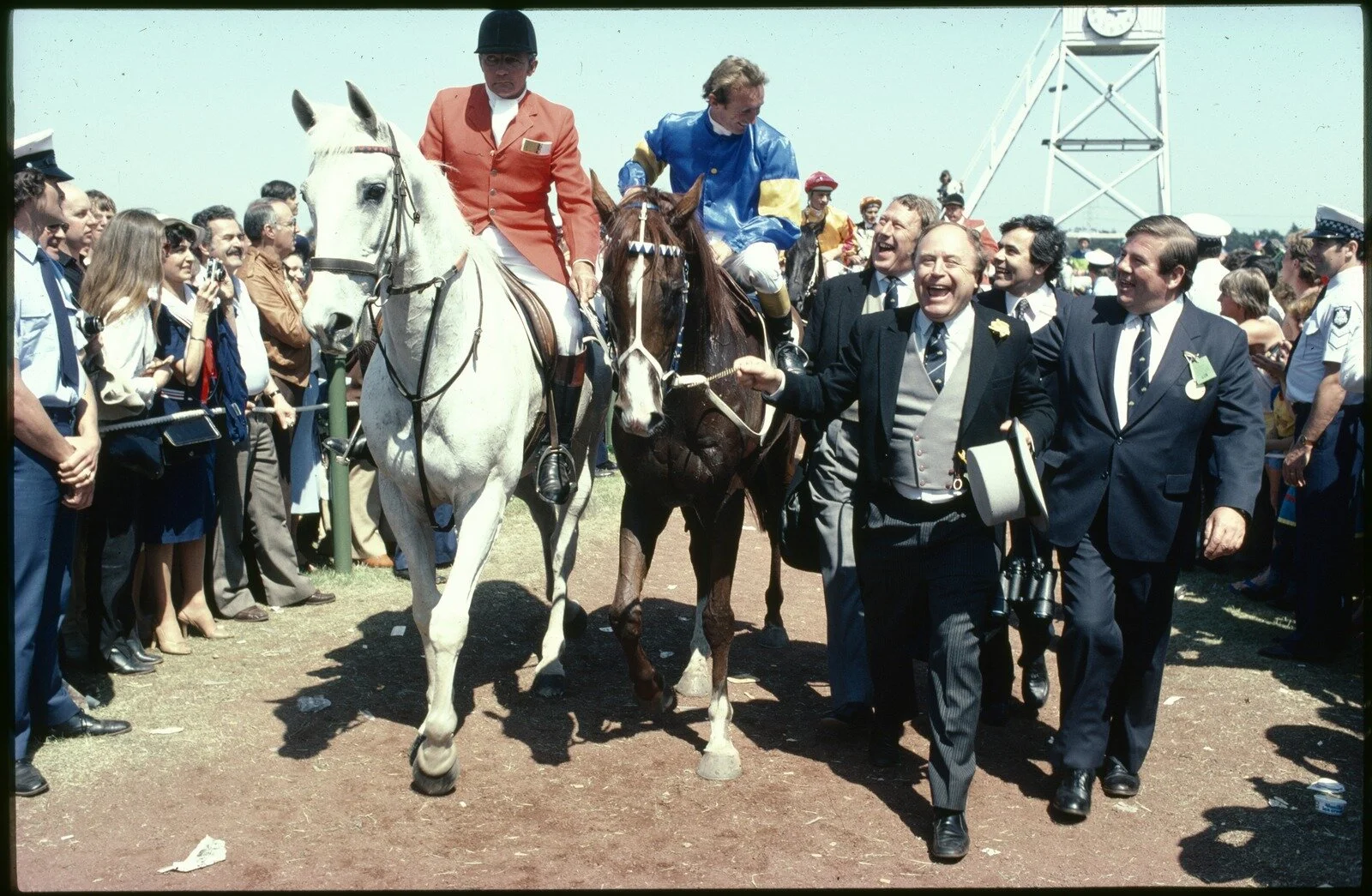 Ellis, R. (1982). [Gurner's Lane after 1982 Melbourne Cup Victory] [picture] / Rennie Ellis., Rennie Ellis Collection. Spring Racing Carnival, Victoria$$QRennie Ellis Collection. Spring Racing Carnival, Victoria. Source: State Library of Victoria.