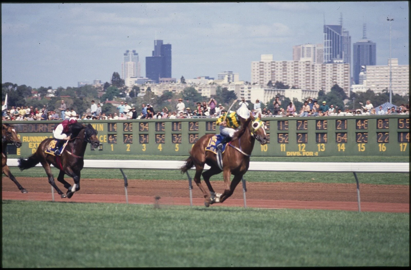 Ellis, R. (1991). "Let's Elope" Runs Away to Win the Melbourne Cup. City in Background. [picture] / Rennie Ellis., Rennie Ellis Collection. Spring Racing Carnival, Victoria$$QRennie Ellis Collection. Spring Racing Carnival, Victoria. Source: State Library of Victoria.