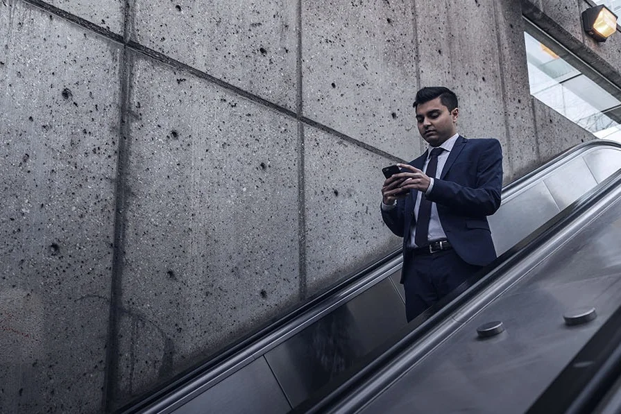 Businessman+on+Escalator.jpg