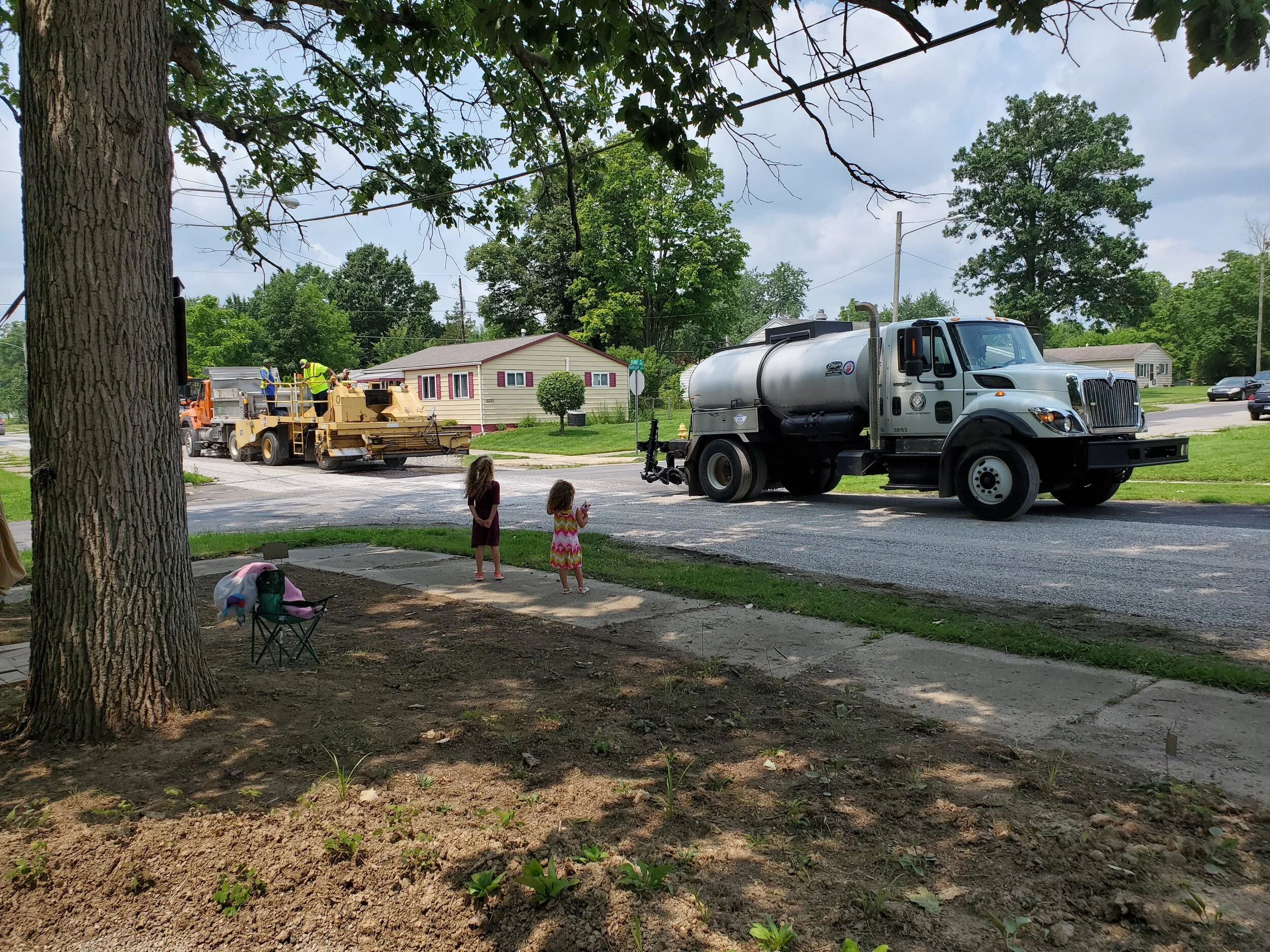C loves heavy machinery, so the chip &amp; seal caravan was a true spectacle for her.