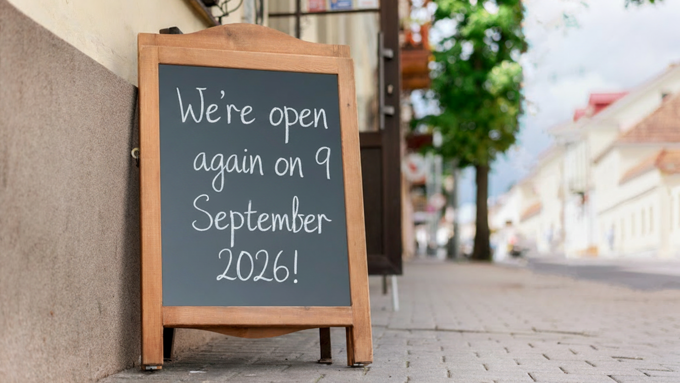 An A-board on a wide pavements says: 'We're open again on 9 September'