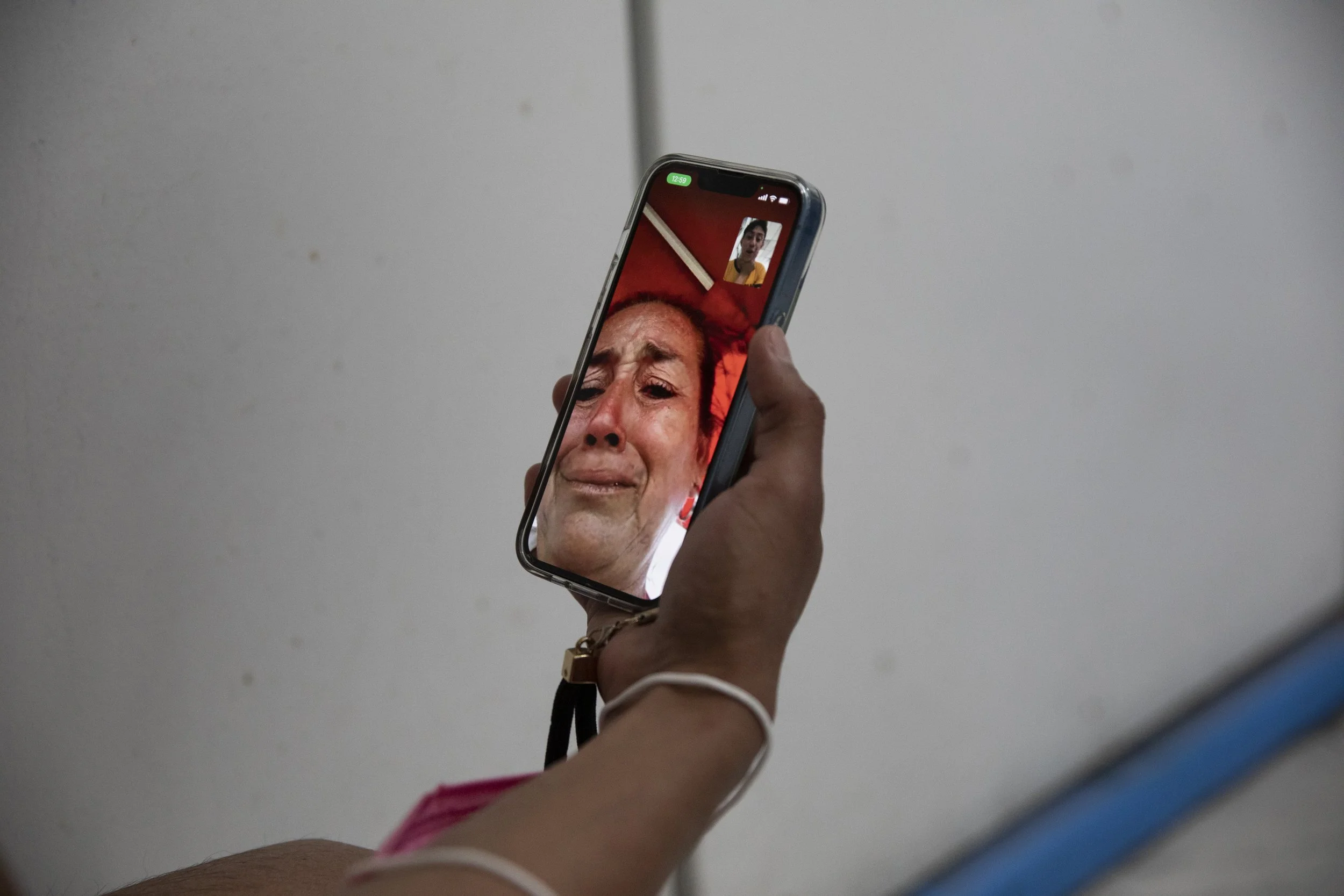  Zethare’s mother reacts after learning through a phone call that Zethare will be allowed to enter the United States. The two have a close relationship, and the mother hopes that Zethare will be able to achieve her dreams in the United States in a wa