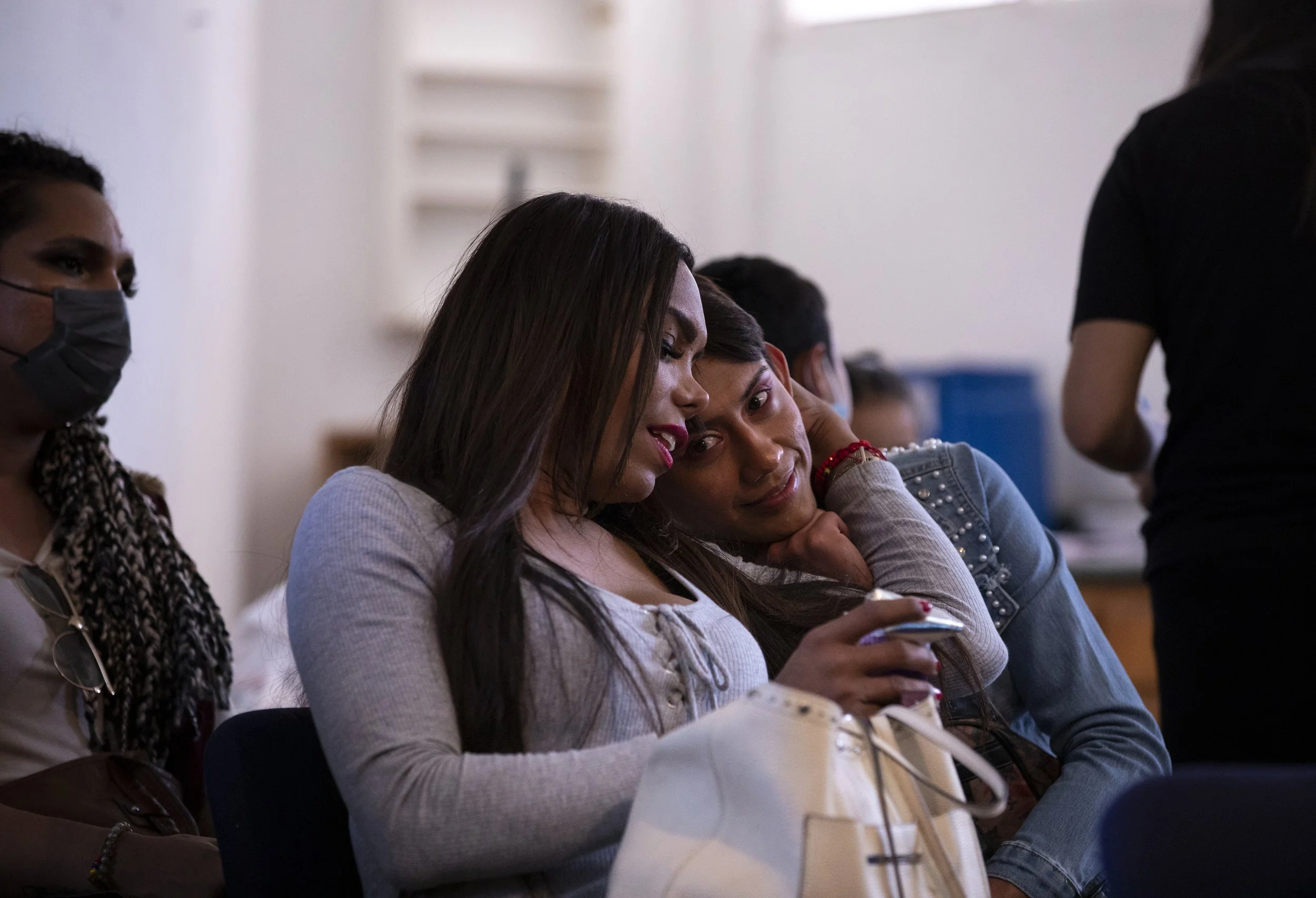  Alinne Audelo, left, and Zethare as they and others receive an orientation about the process they’re about to go through when they reach PedWest pedestrian border crossing. 