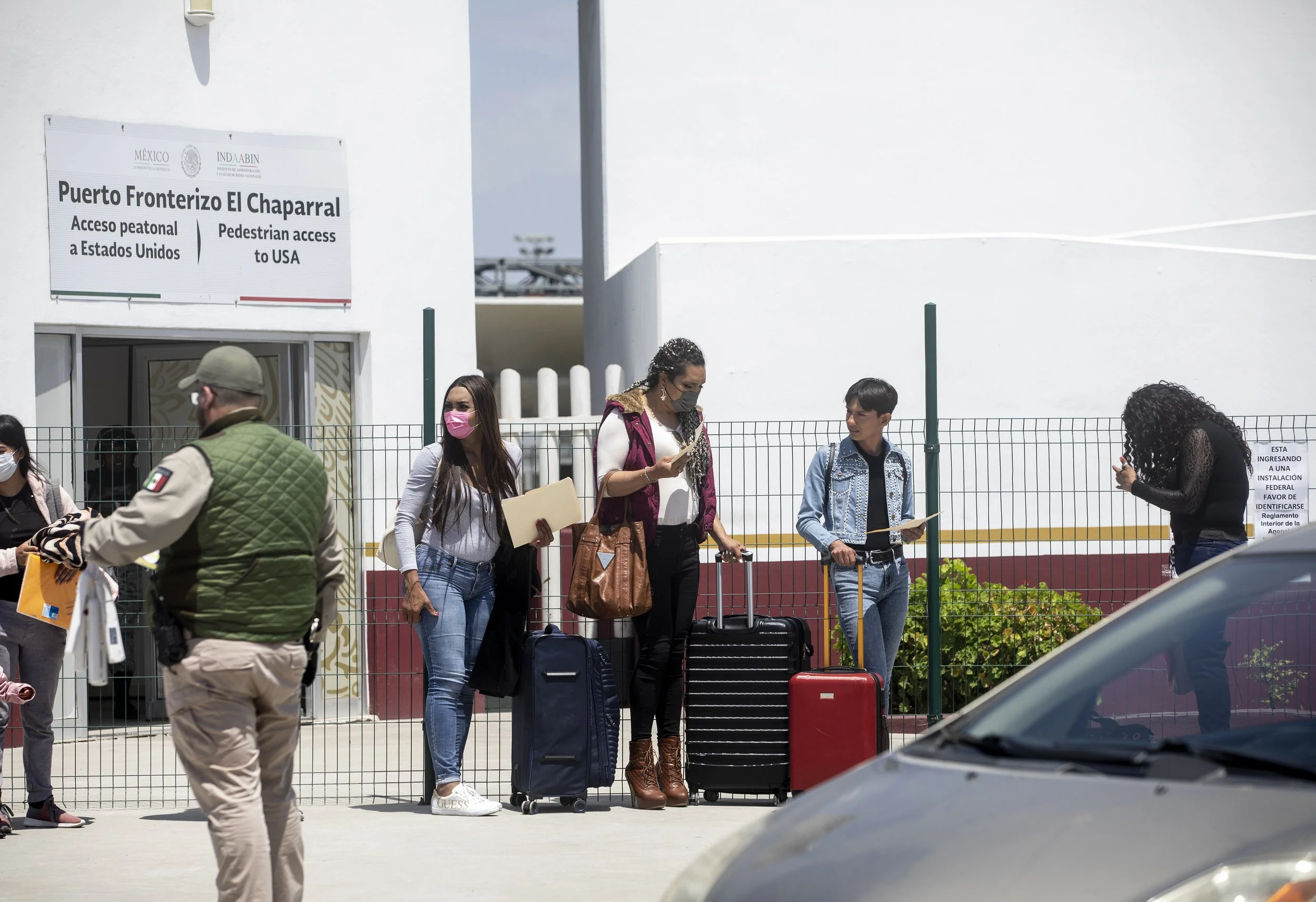  Zethare waits to walk into the western entrance of the main port of entry between San Diego and Tijuana, known as PedWest on the north side and El Chaparral on the south side. She paused to wave shortly before walking in.  