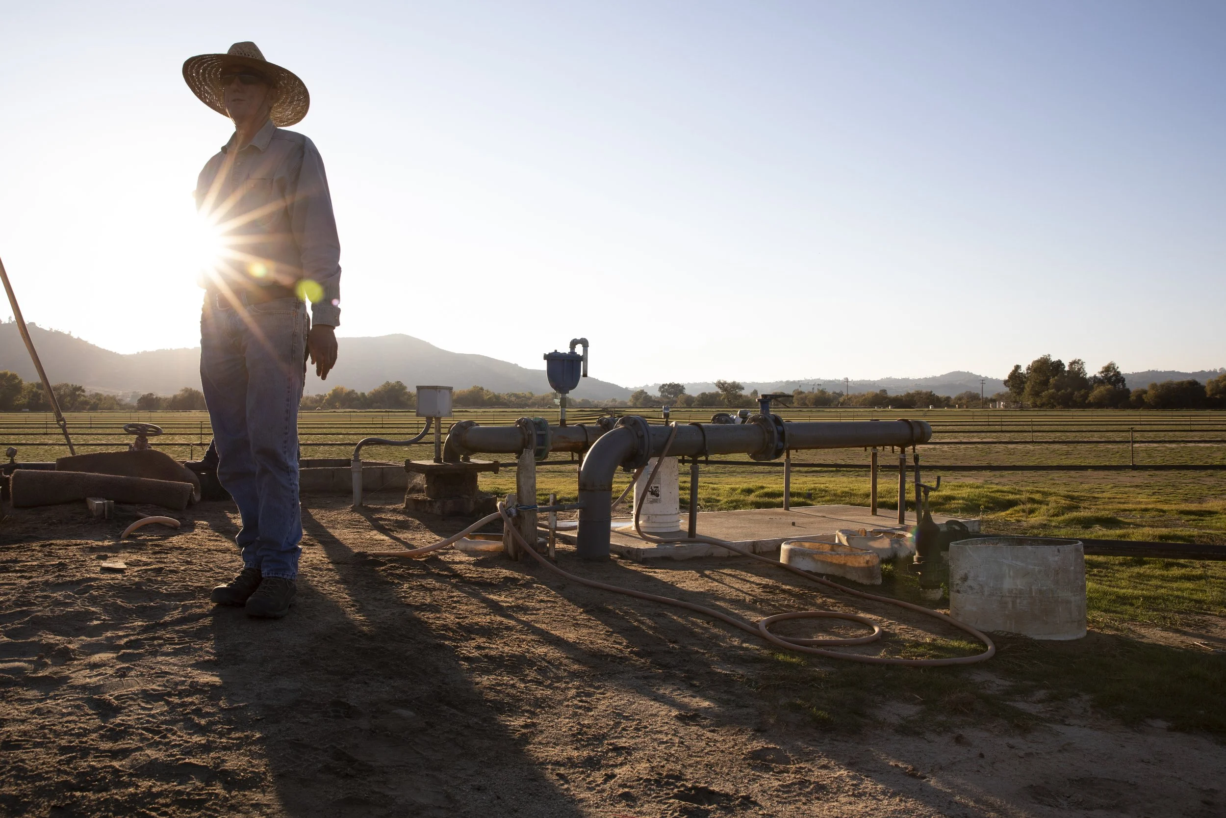  Matt Witman troubleshoots his irrigation system on his tree farm in the San Pasqual Valley. 