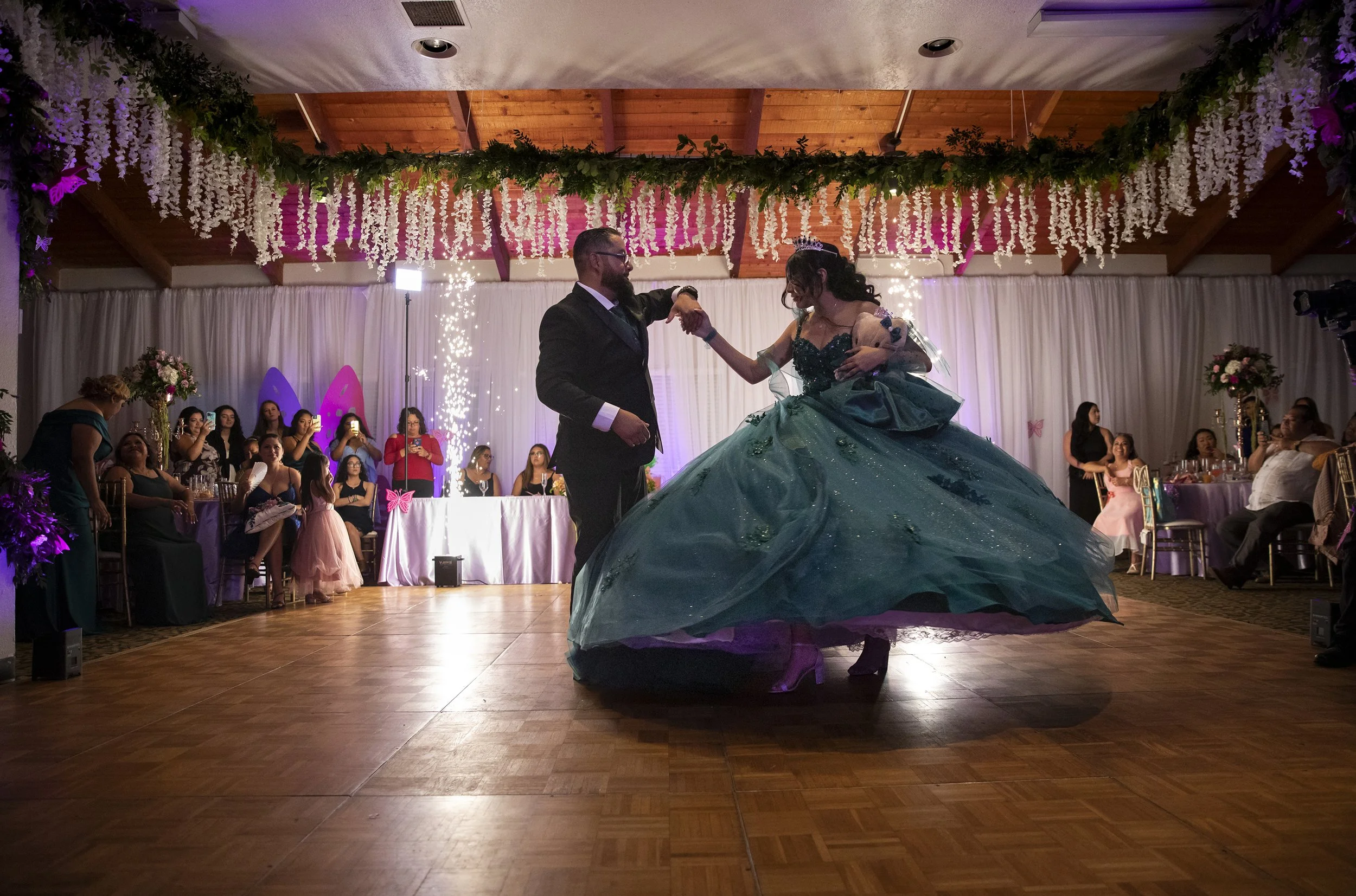  Cesar Ploneda dances with his stepdaughter Zoey Mary Jane Grande as they celebrate her quinceañera at the Marina Village Conference Center on Tuesday, Aug. 30, 2022 in San Diego, California.  