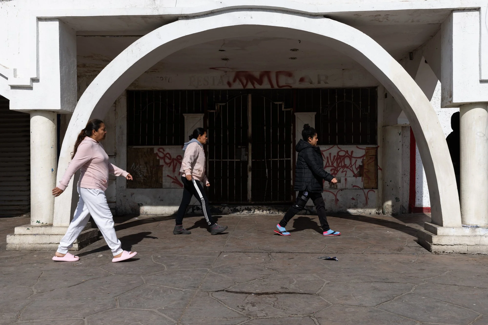 A group of migrants staying at a shelter head to Pedwest Port of Entry to try to understand what is happening after receiving news that their CBP One appointments were cancelled on Monday, Jan. 20, 2025 in Tijuana, Mexico. 