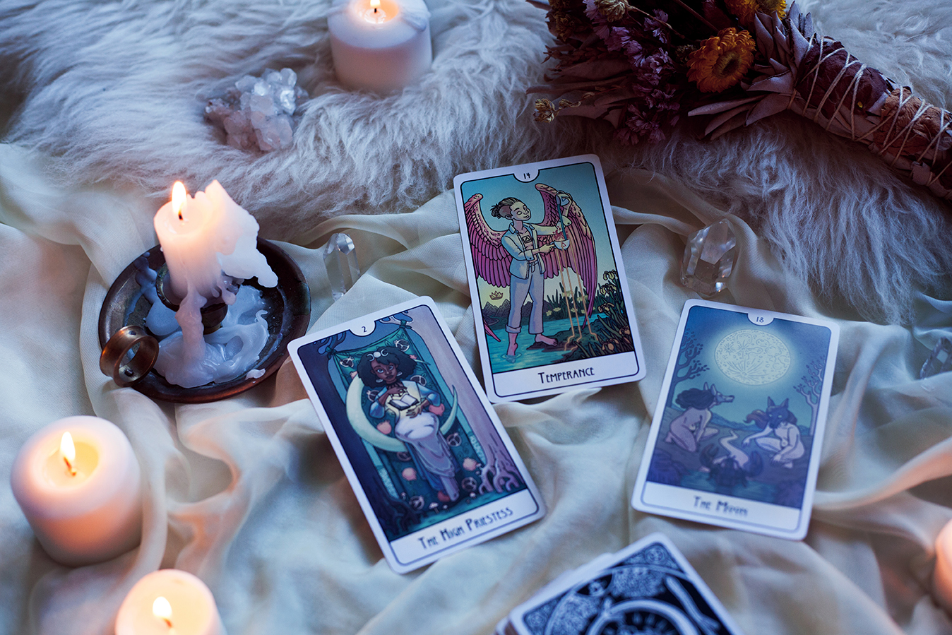  Image shows three cards surrounded by crystals add candles. The cards are the High Priestess, Temperance, and the Moon. First printing.   