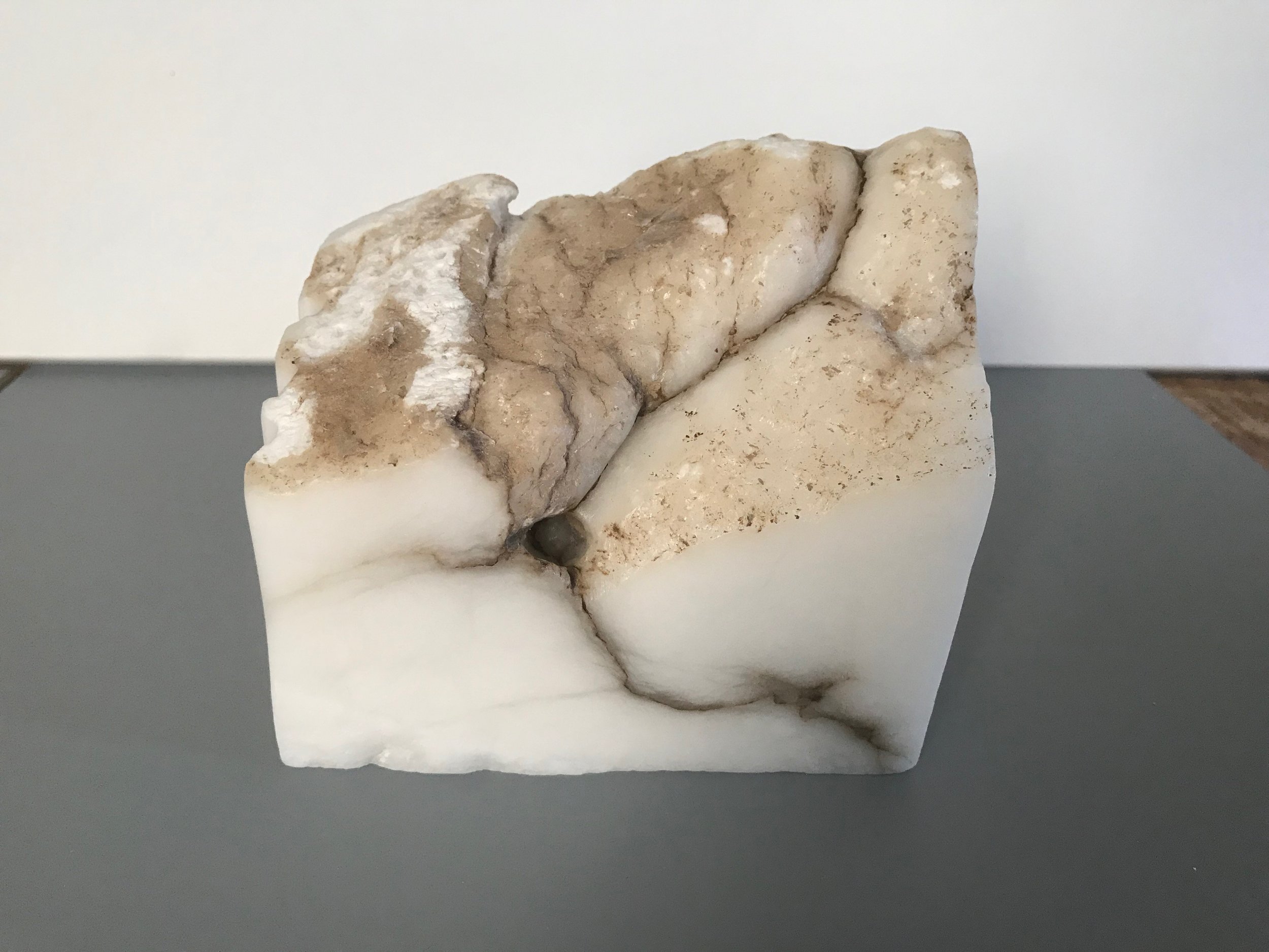 Drought, 2019. Hand-carved opaque white alabaster. Dimensions: 3.75” H x 4.25” W x 2.5” D (approximate). Price available upon request.