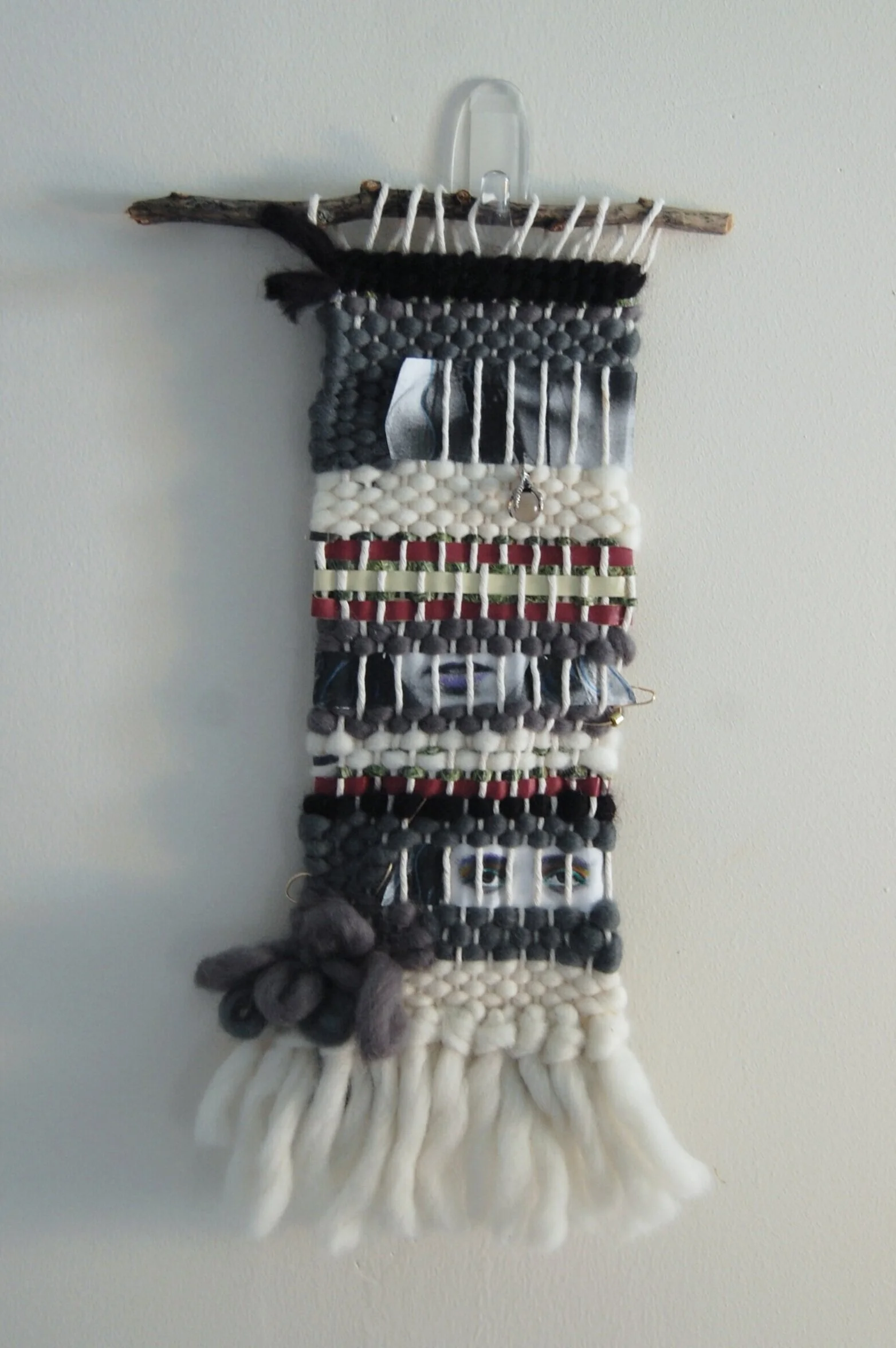 Perspective, 2019. Woven wool yarn, cut hand-colored photograph, and gold wire on cotton warp with gold bead and crystal charm on found twig. Private collection.