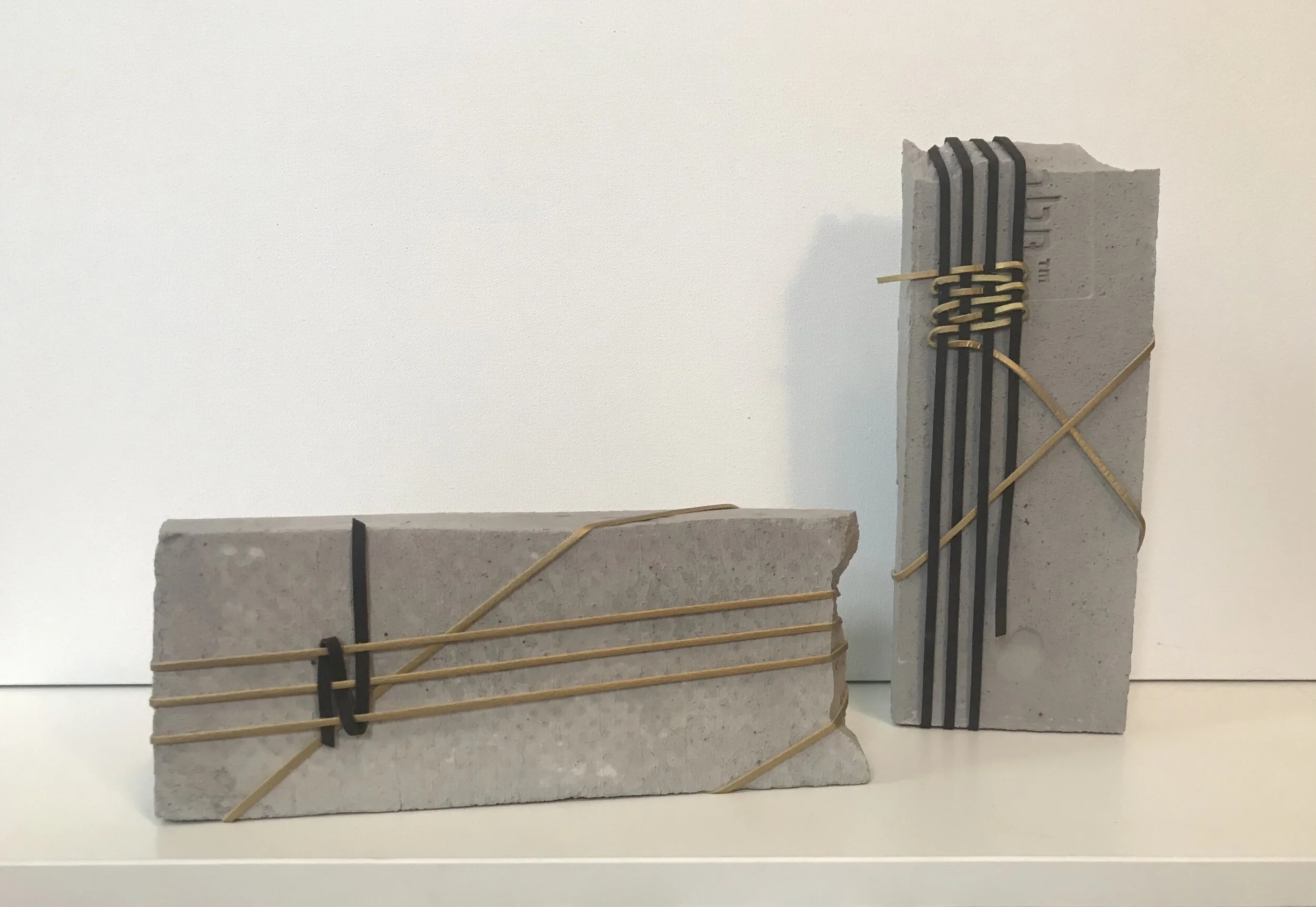 (w)Rapture No. 1,  2021. Assemblage of clay stone and leather laces.