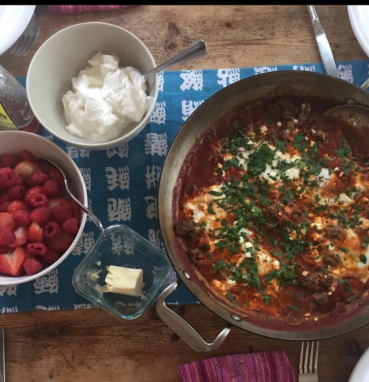 Poached Eggs in a Spicy Tomato Sauce with Beans and Greens