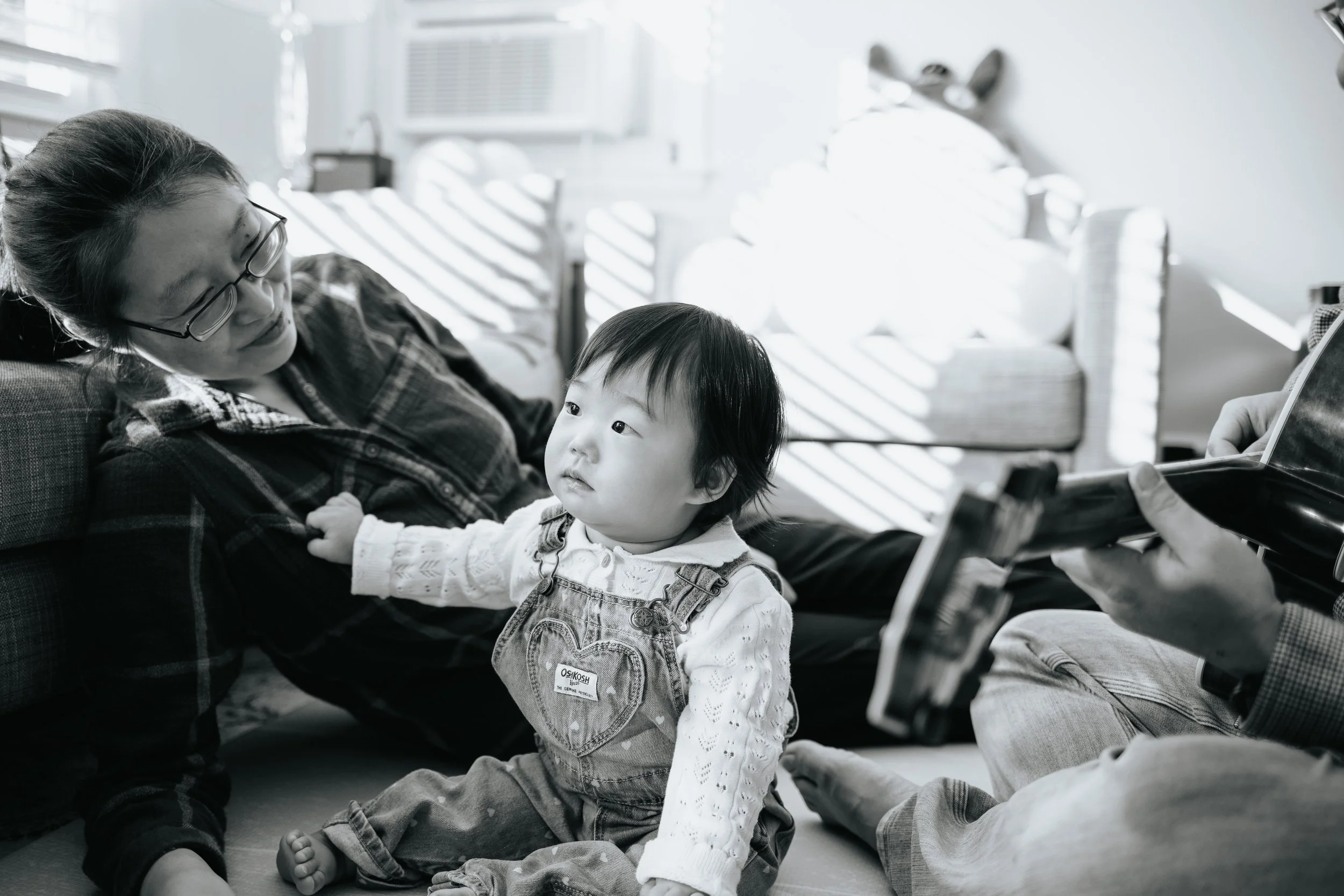 Black and white photo of baby and mother during a family session in Grafton.