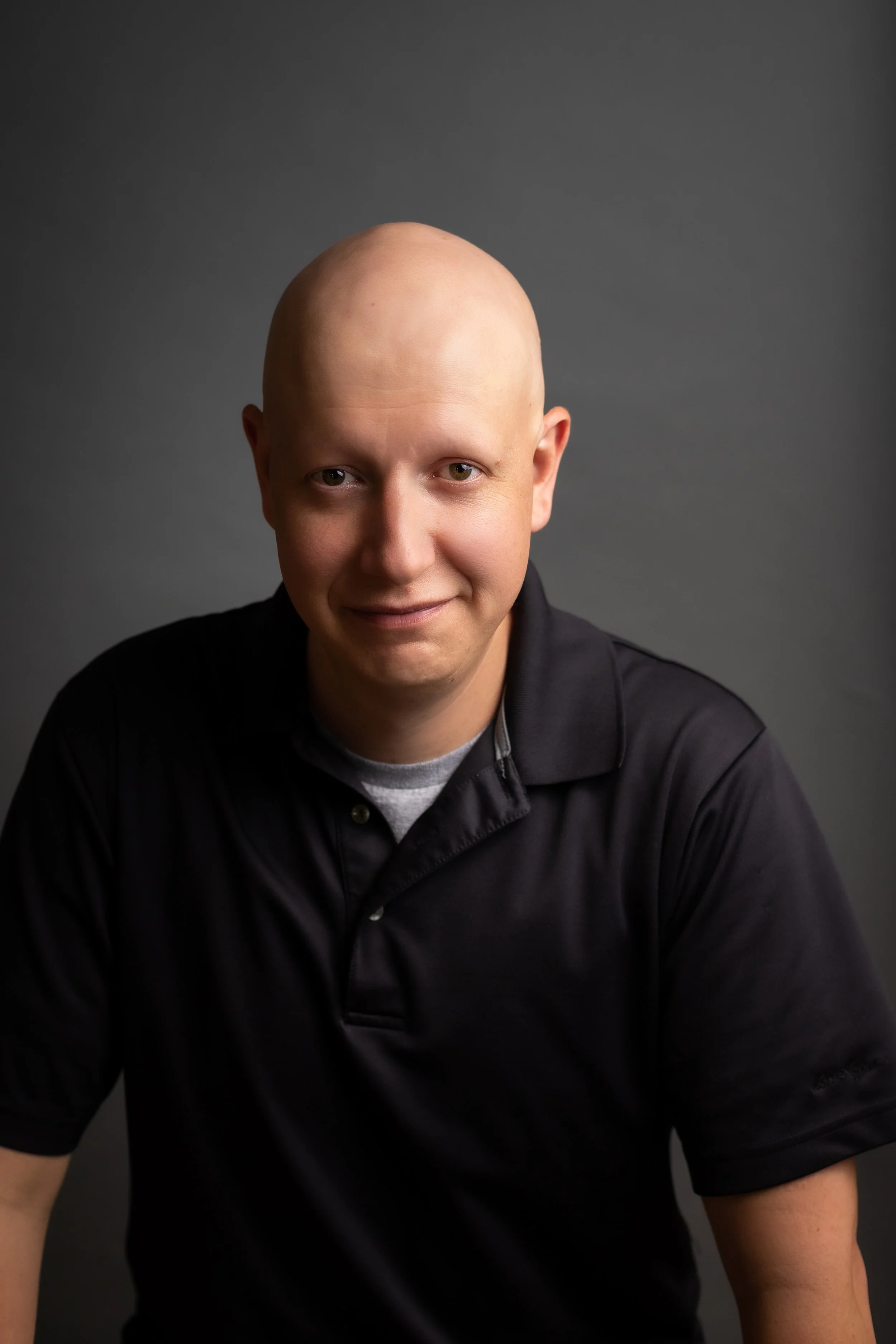 Studio headshot for podcast host by Worcester headshot photographer Tom Godfrey Photography.