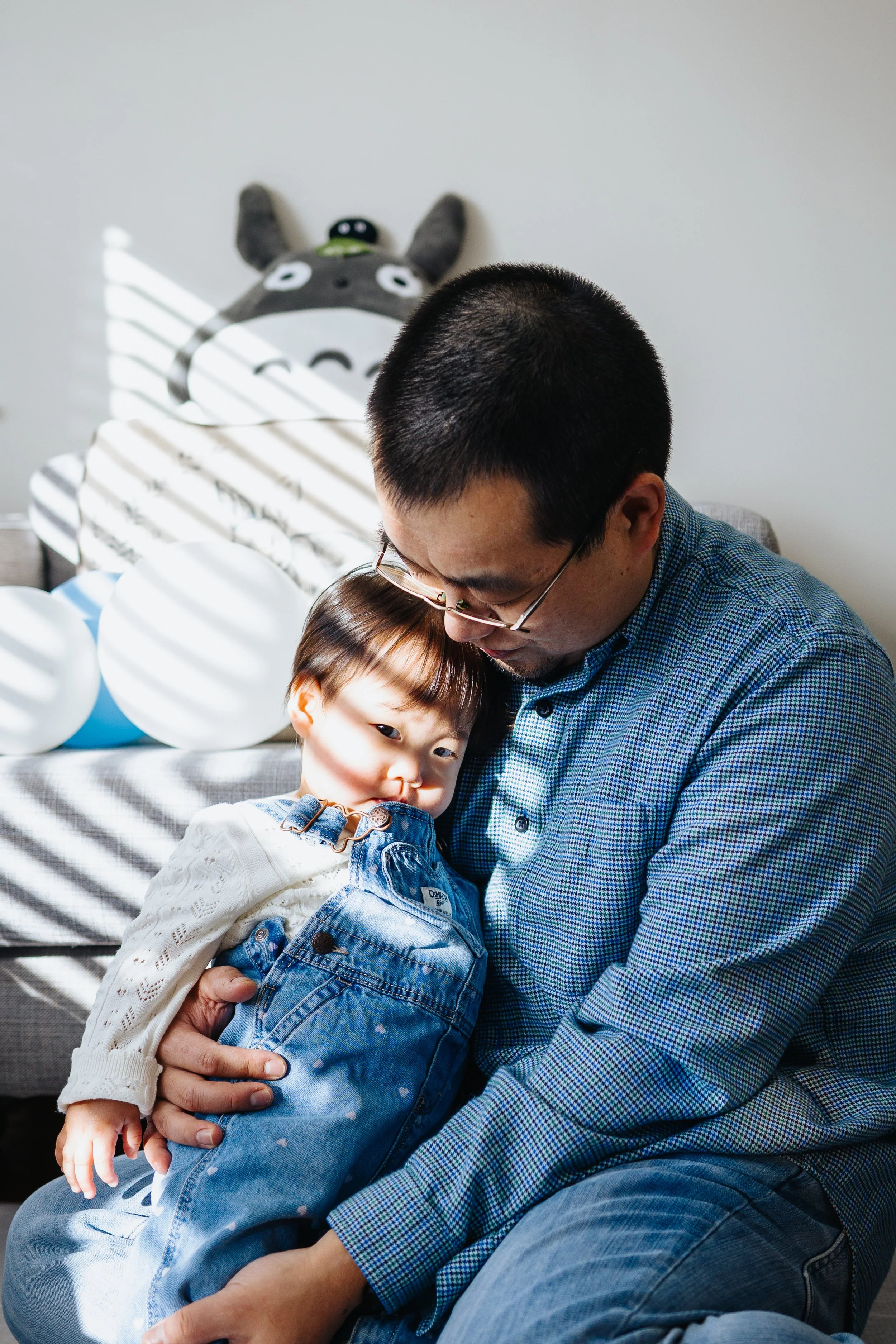 Natural light portrait of baby and dad during lifestyle session in Grafton, MA.