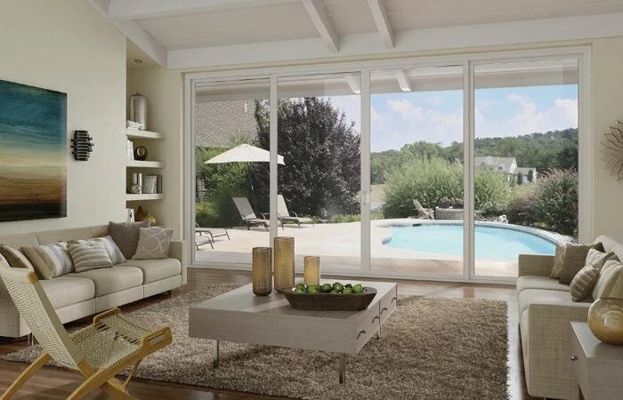 Custom sliding glass doors looking out at a pool