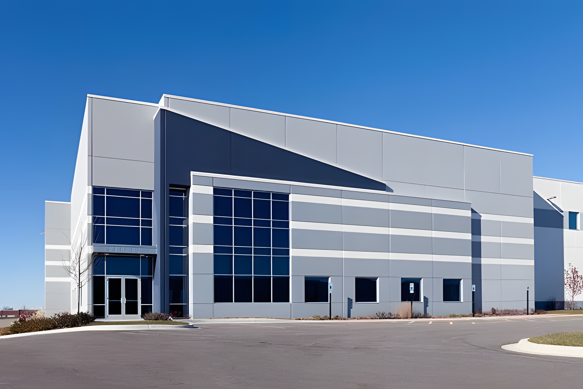 Numerous windows on the outside of a large industrial building