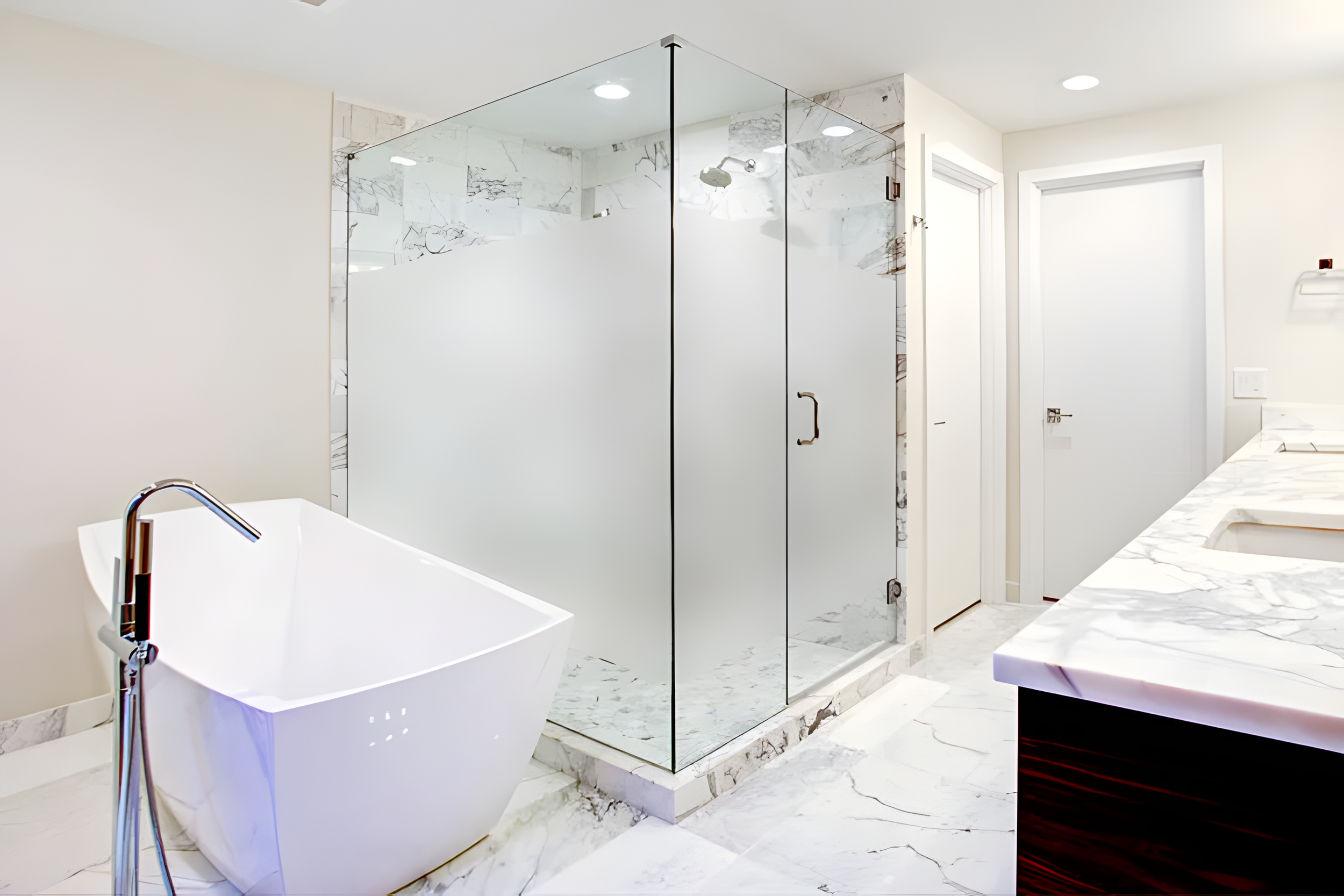 Large bathroom with frameless shower glass that has privacy film installed by East Whittier Glass