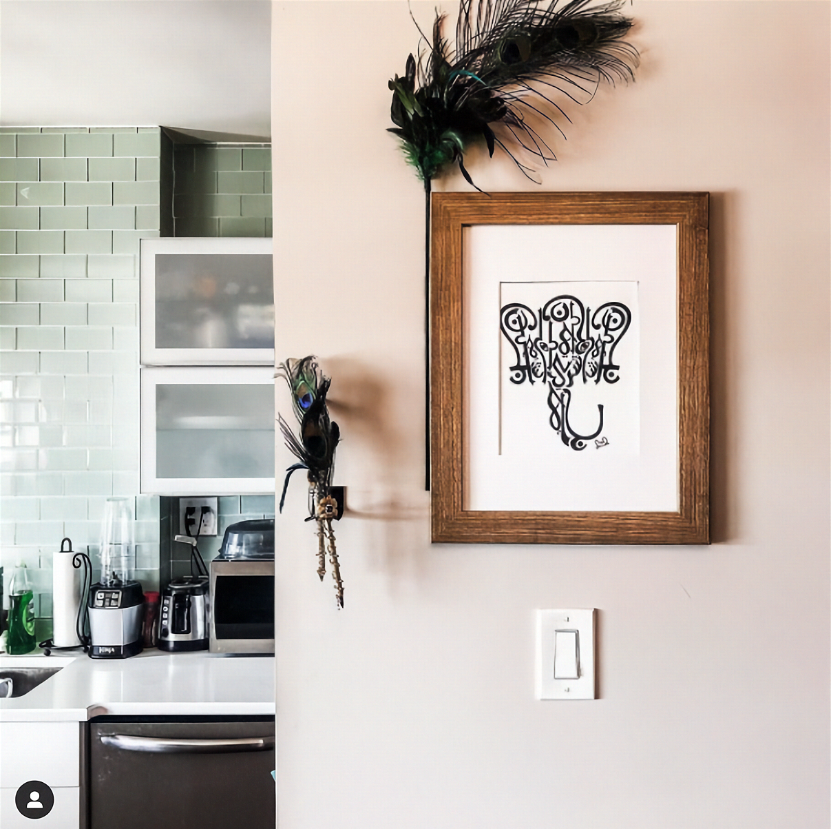 Arabic calligraphy Ganesha artwork by Sangeetha Kowsik displayed in a Hindu-Muslim couple’s home, symbolizing their shared faith traditions.