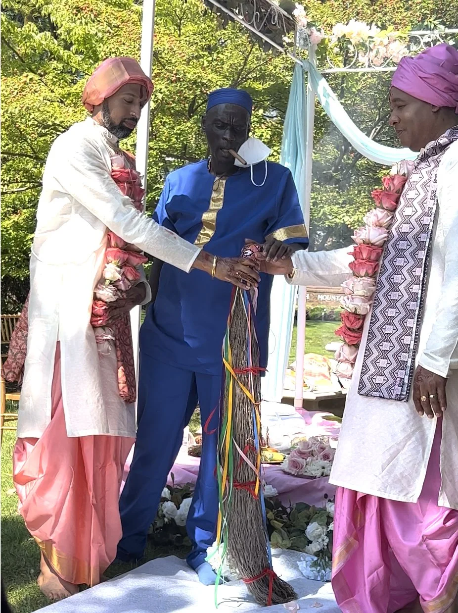 Yoruba and Hindu families participating in an interfaith wedding ceremony celebrating the cultural heritage of both traditions.