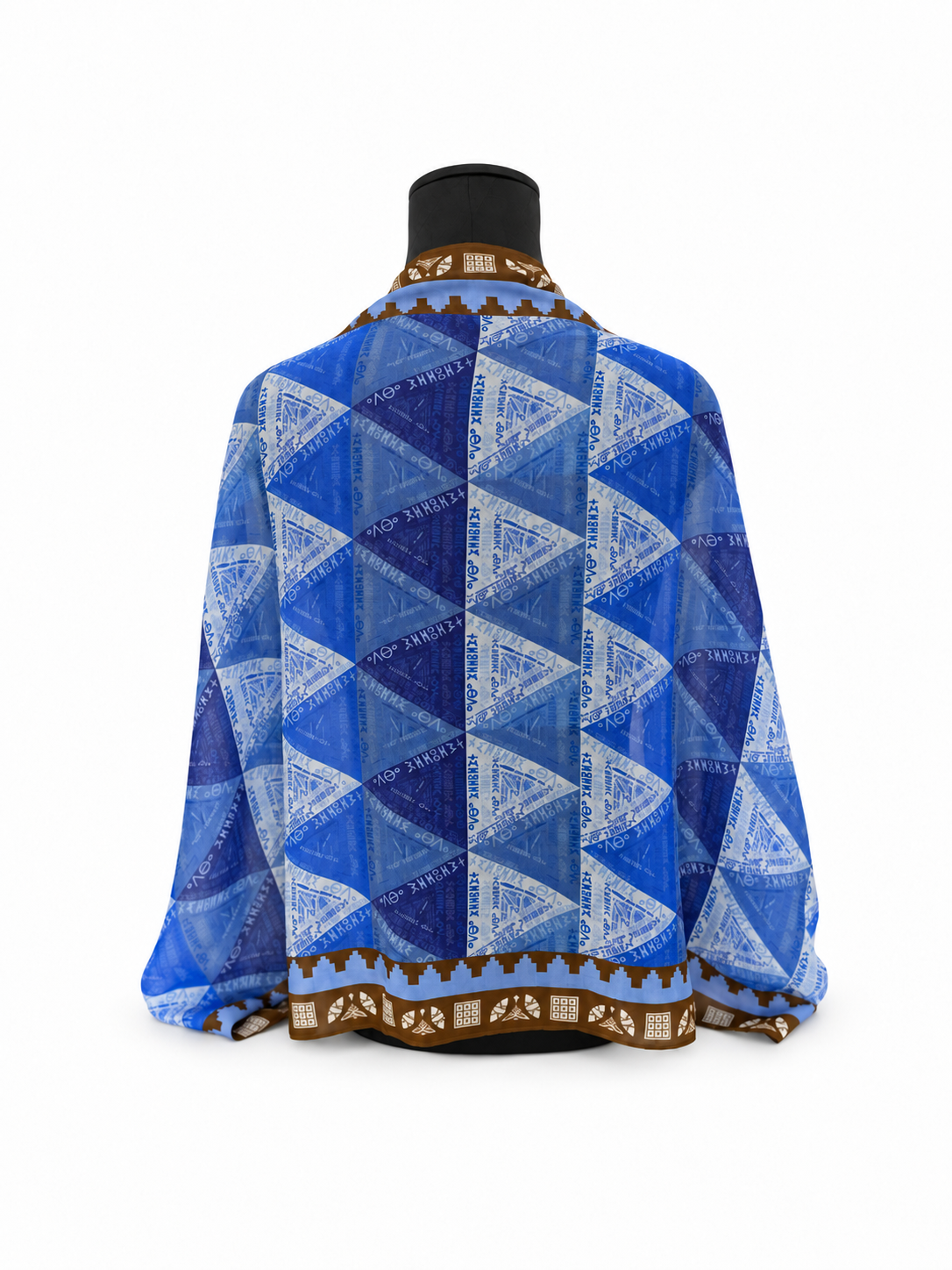 Back view of blue Amazigh Tillei Abda scarf by Ihsan Ishan Design featuring repeating geometric patterns and Tifinagh script inspired by North African heritage.