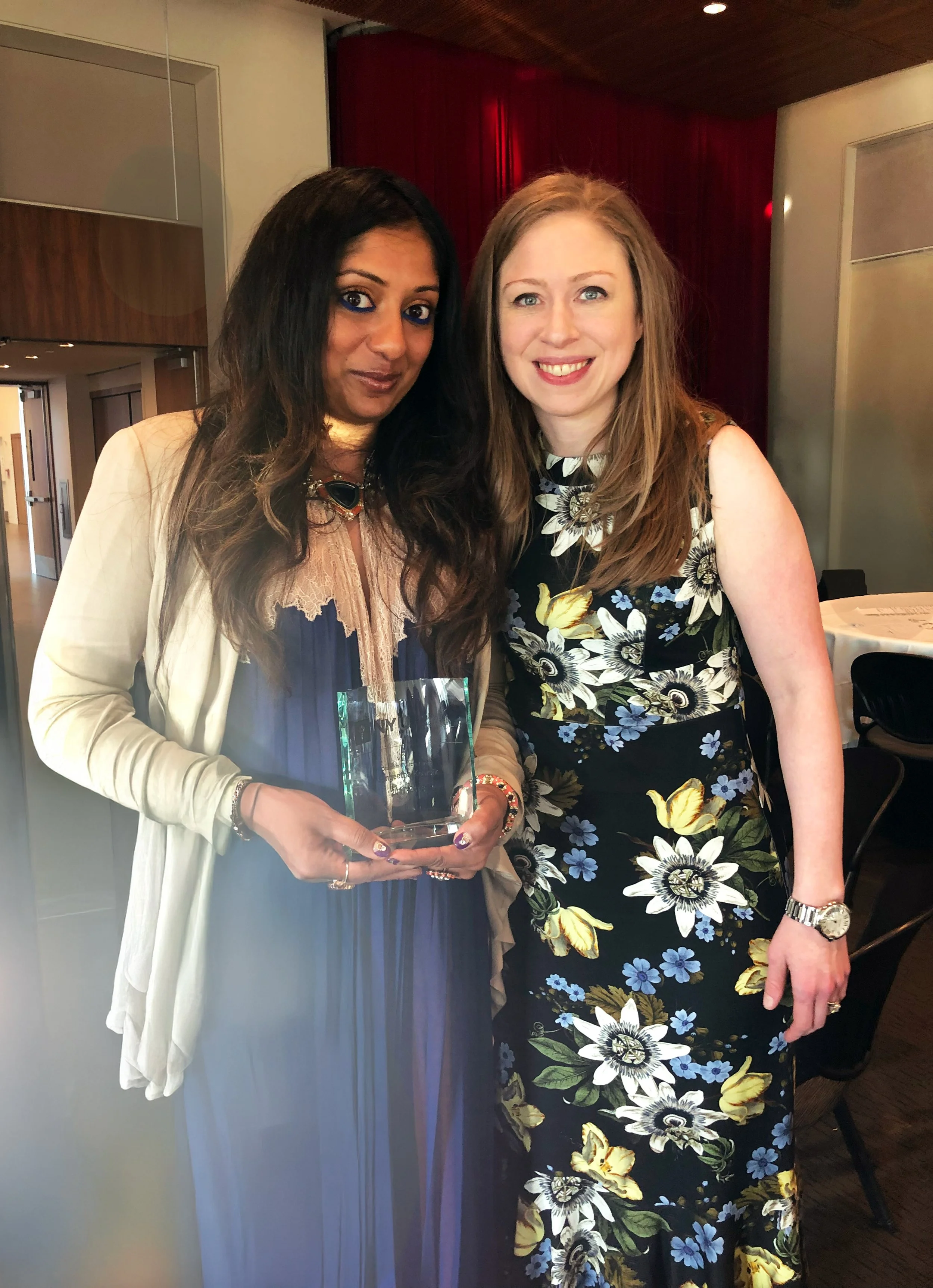 Sangeetha Kowsik receiving Chaplain of the Year recognition for interfaith initiatives, presented by Chelsea Clinton