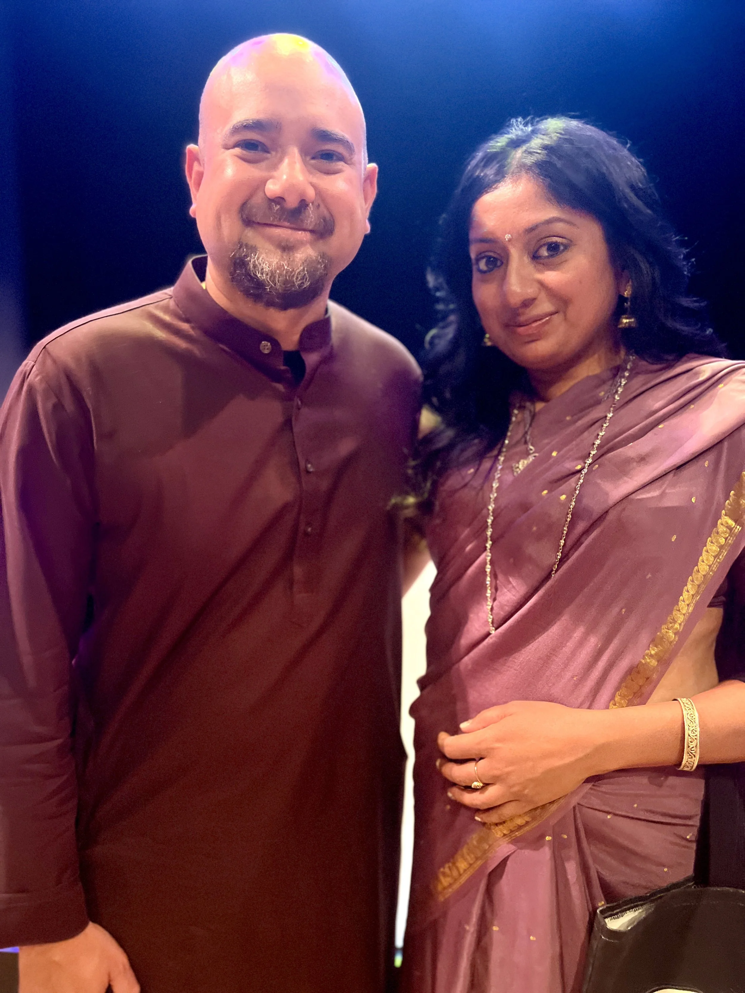 Sangeetha Kowsik with sarod musician Alam Khan, whose Indian classical music and cultural heritage inspired her custom Arabic calligraphy sarod design.