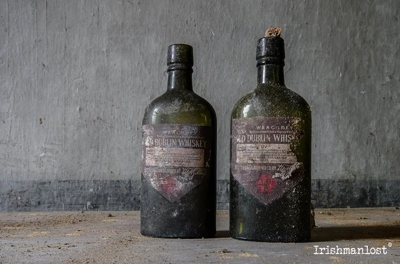 two old dublin whiskey bottles found in a abandoned mansion in ireland
