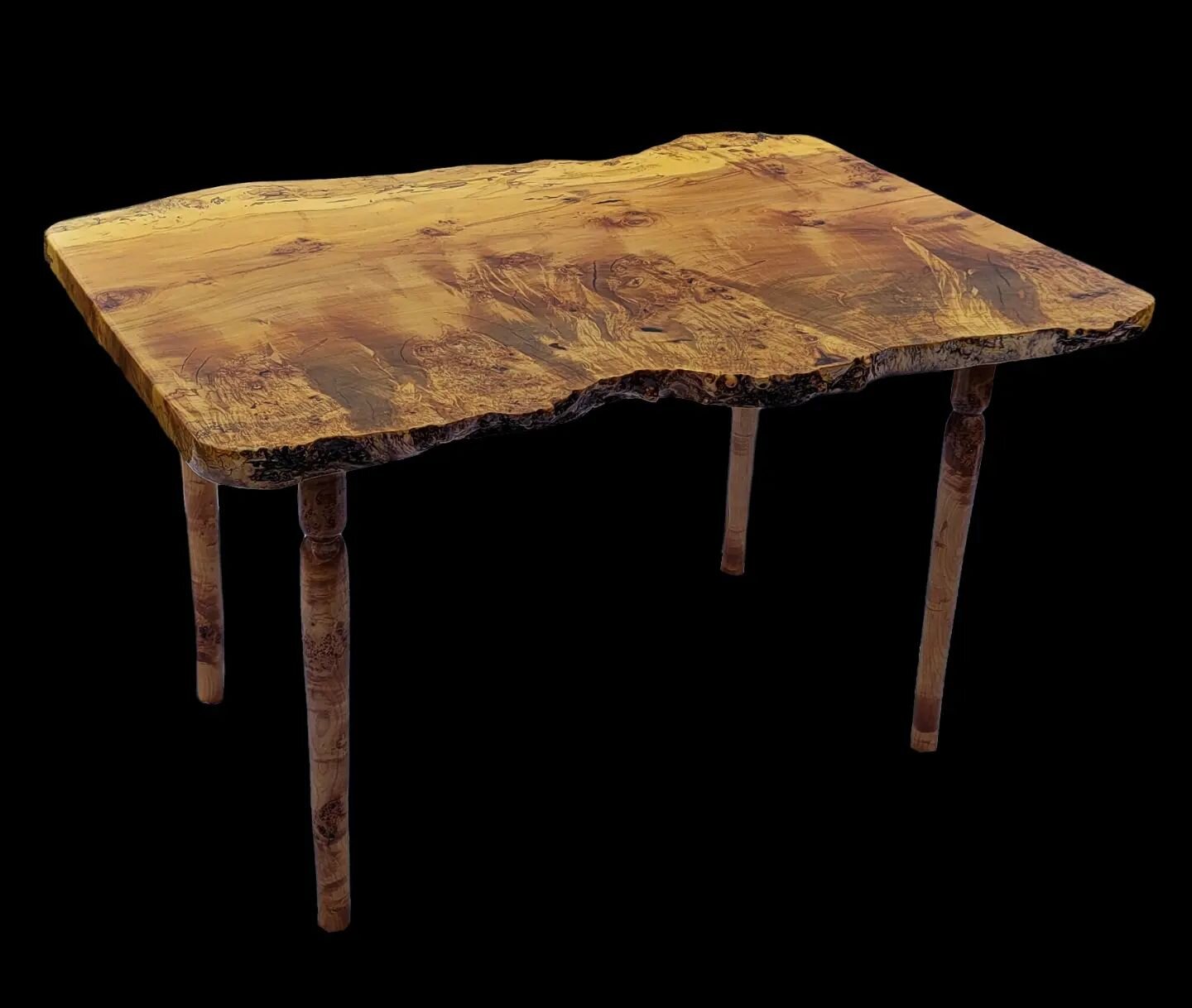 Our latest Burl Maple Writing Desk is made from a single hardwood slab and its mortise &amp; tennon construction is sure to give it a long and durable life. The table is finished with spar varnish.
49&quot; length, 29.5&quot; height, 32&quot; - 36&qu