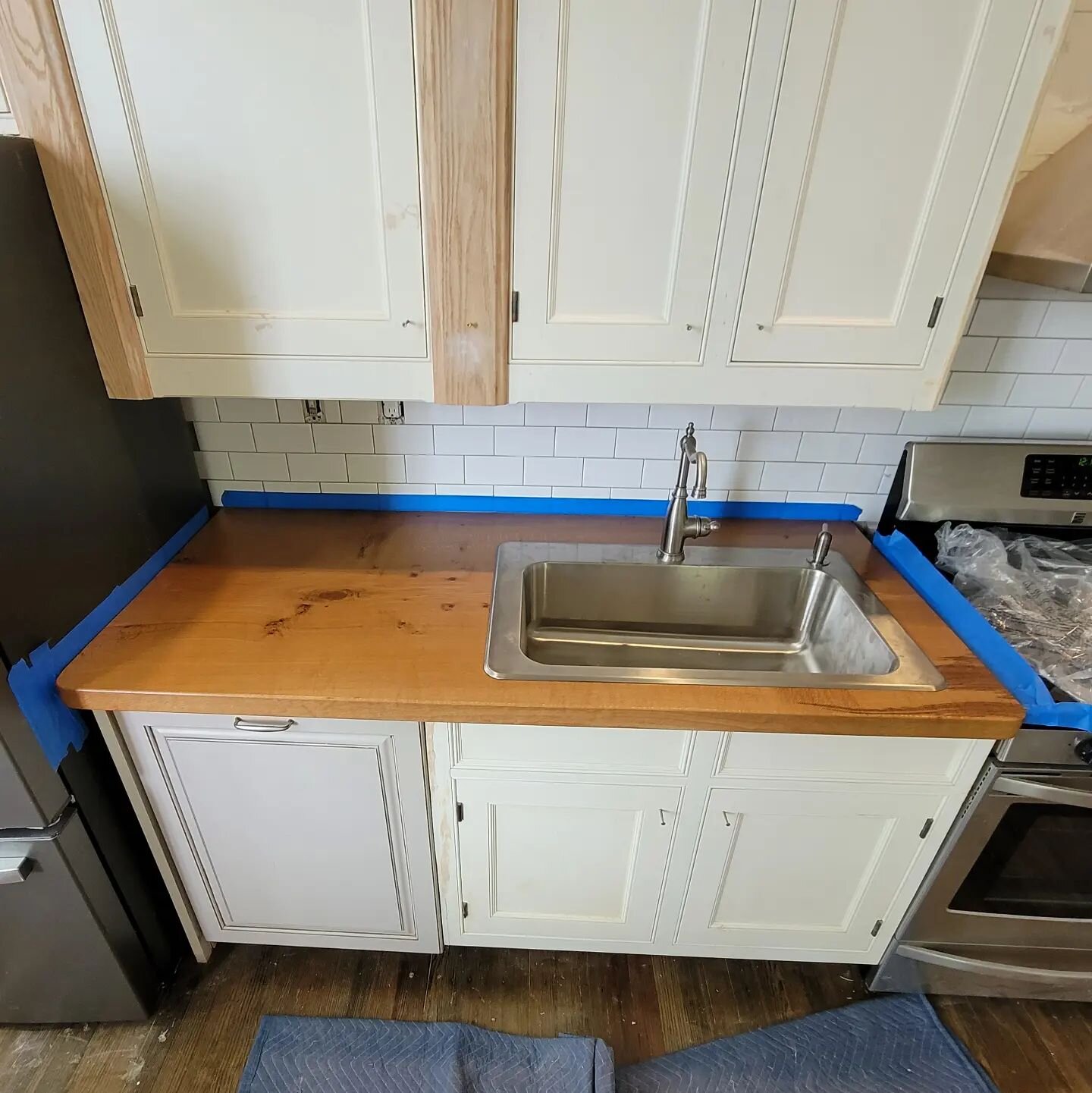 White oak works well for countertops, it's rot resistant and so hard that it just needs  a bit of Odies oil.