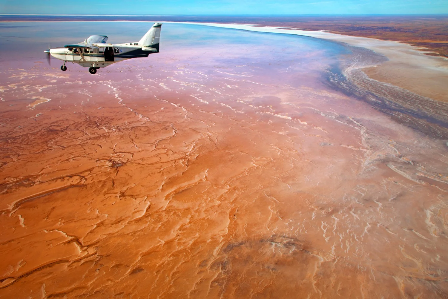 Flying over Lake Eyre. Image credit: Peter Rowe, South Australian Tourism Commission