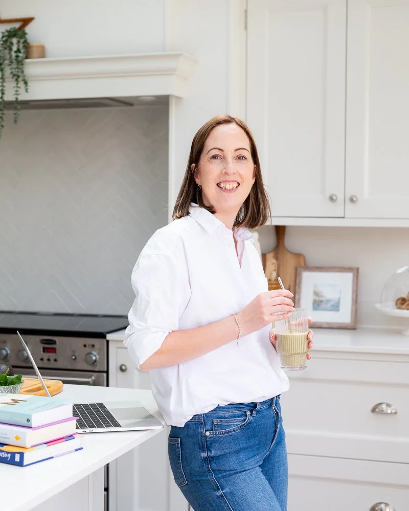 Nutritionist and health coach in her kitchen during a personal branding photography session