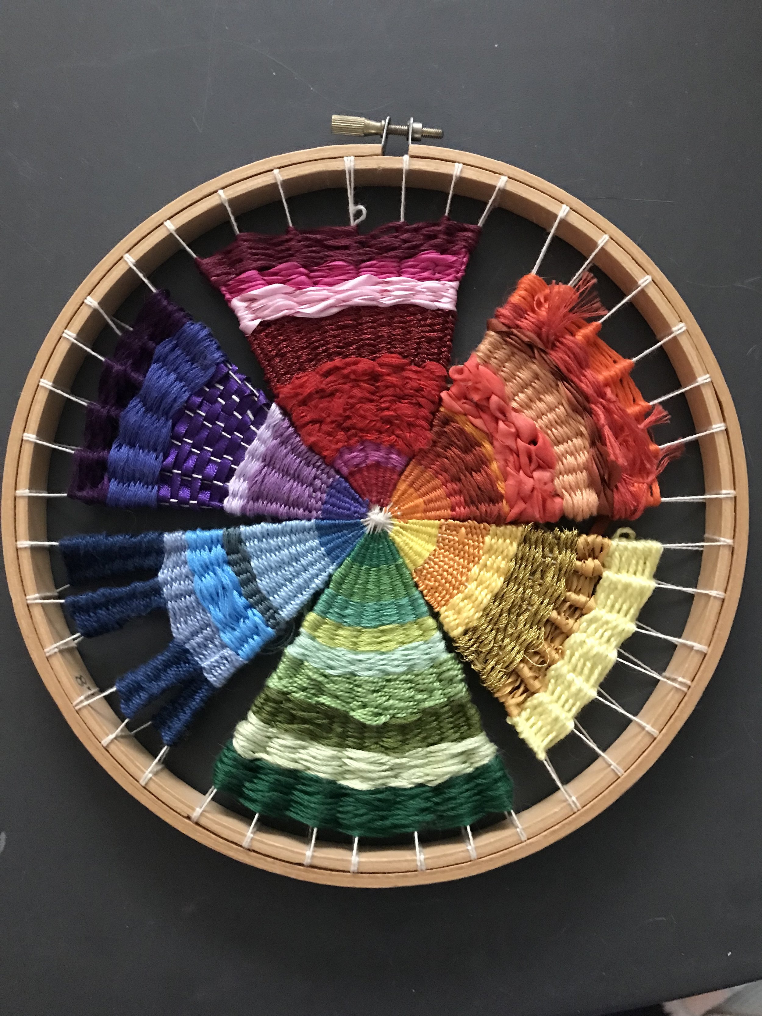 Hand woven color wheel with self-dyed fibers.jpg
