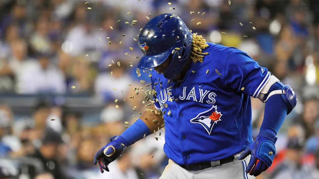 Vlad Guerrero Jr getting showered with seeds.