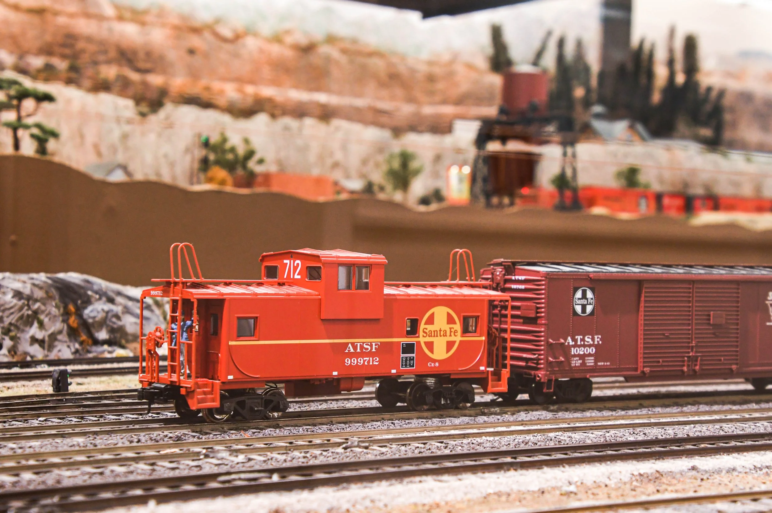 a model train caboose on a layout at the San Diego Model Railroad Museum
