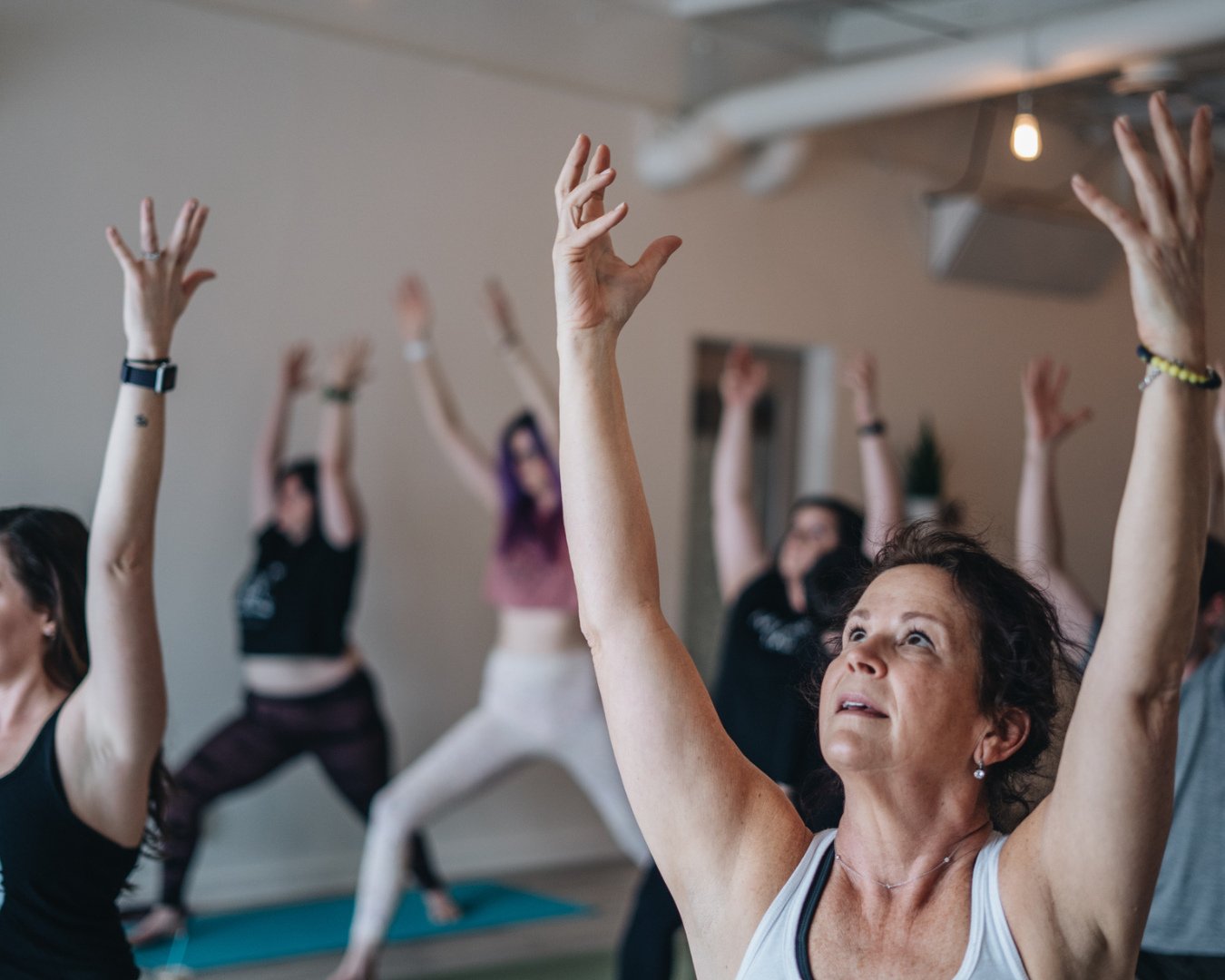 Rise together, breathe together, grow together. 🌞✨⁠
⁠
There&rsquo;s something magical about practicing in community&mdash;feeling the collective energy lift the room as each person reaches toward their own light. Yoga isn't just about movement; it&r
